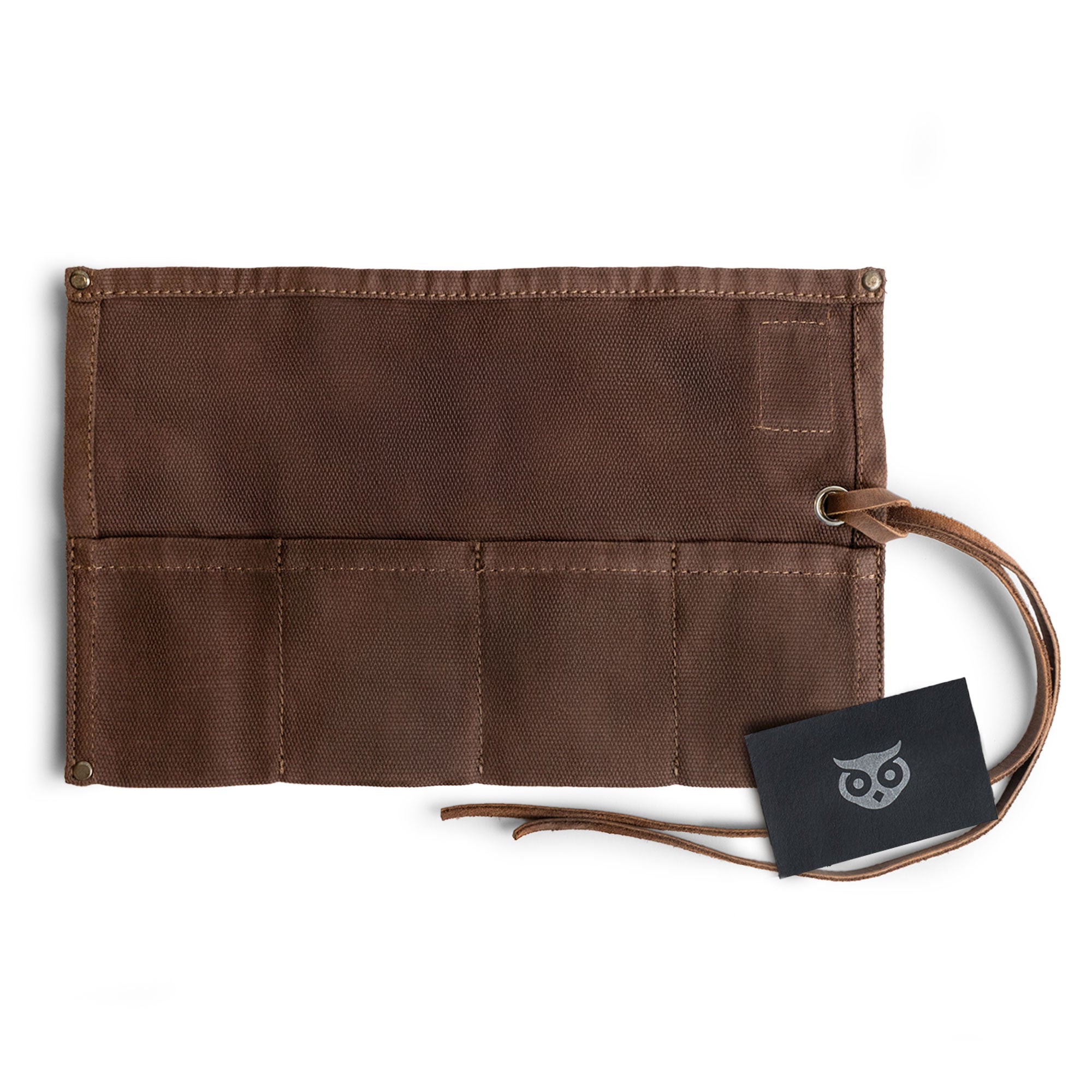 An elegant Waxed Canvas Watch Roll by Hide & Drink showcased alongside its branding card, highlighting its artisan craftsmanship and ability to hold up to 4 watches.