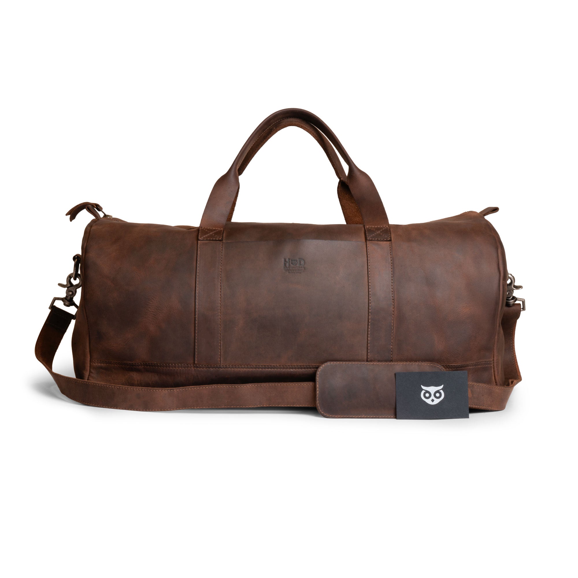Hide & Drink Luggage Duffle Bag with Shoulder Strap displayed in classic Full Grain Leather, ready for travel as an overnight bag, highlighting its artisanal quality through small batch production and hand sewn features, made in La Antigua Guatemala & Oaxaca Mexico.