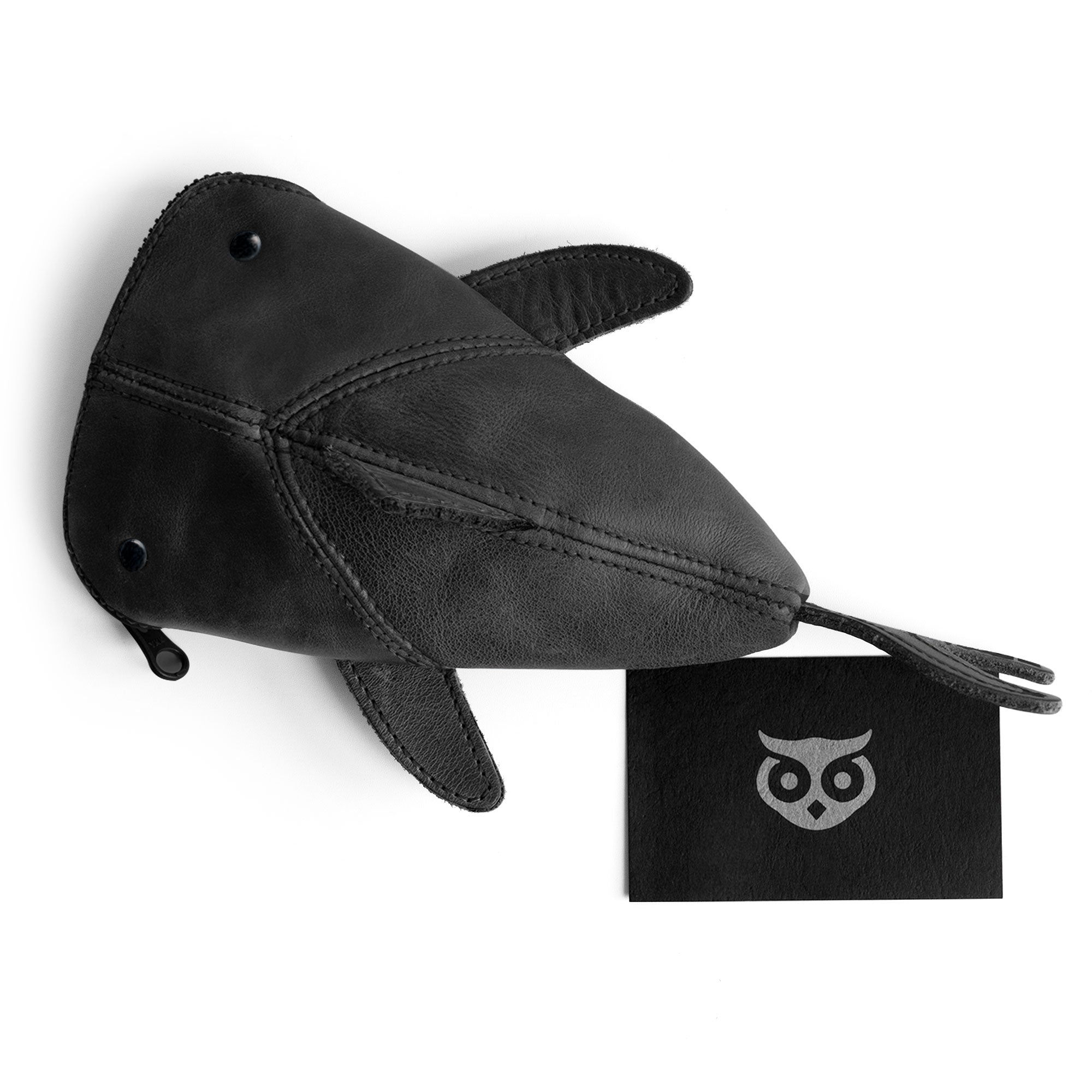 Top view of the Leather Shark Pouch by Hide & Drink, complete with a zippered closure. This unique shark shaped case is made from luxurious full grain leather and is ideal for organizing supplies. Perfect as a change bag or pencil purse, this handmade accessory reflects artisan craftsmanship from La Antigua Guatemala & Oaxaca Mexico.