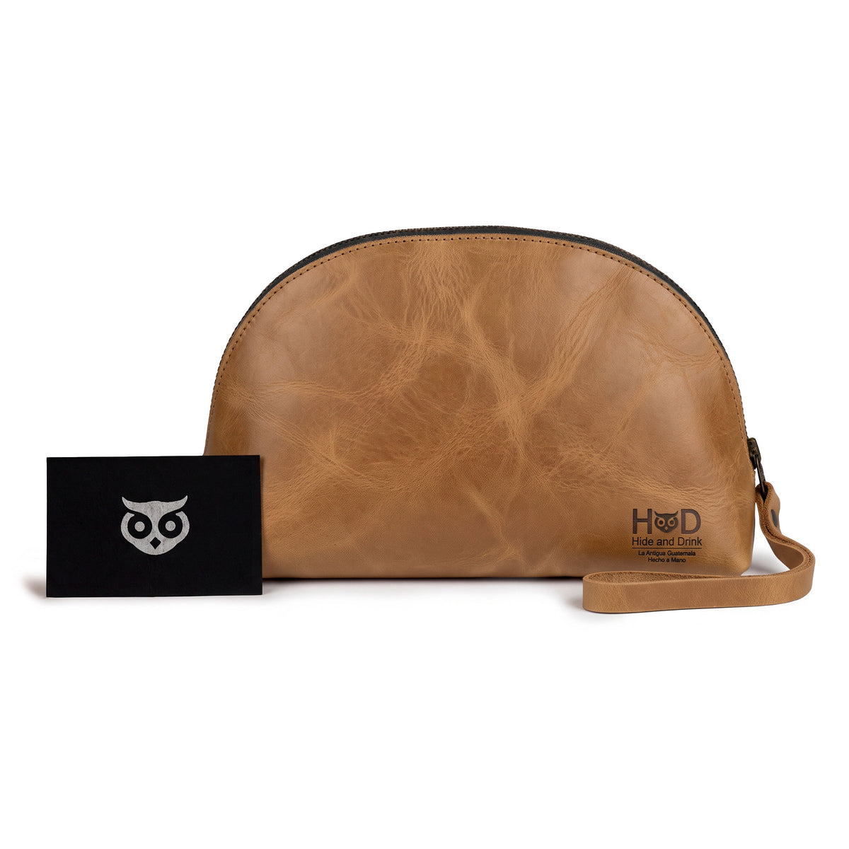 Accessory Pouch Organizer Hand Bag by Hide & Drink in a rich brown color, featuring full grain quality. This versatile Cosmetic Travel Organizer with Hand Strap for Women doubles as a Makeup Bag and Classic Handbag, showcasing artisan craftsmanship from La Antigua Guatemala & Oaxaca Mexico.