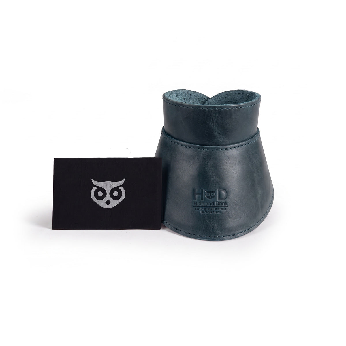 Showcase of Hide & Drink Chemex Collar in navy leather lying flat, featuring quality craftsmanship. Designed as a pour over collar compatible with Chemex 6-Cup Glass, made in La Antigua Guatemala & Oaxaca Mexico.