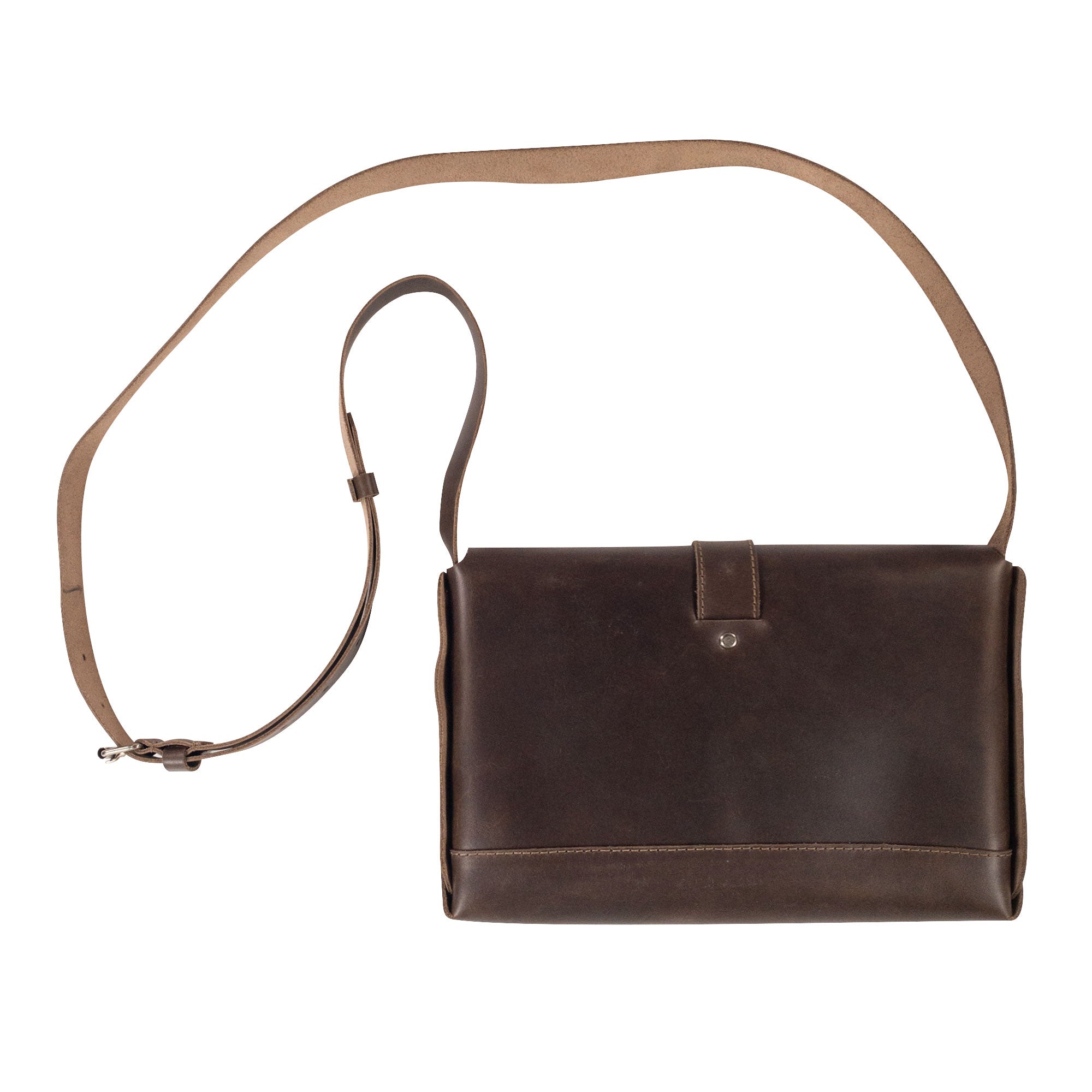 Vintage Leather Satchel by La Antigua, displaying the sleek exterior with an adjustable strap. This classic style satchel is made with full grain leather, hand cut and sewn, representing small batch production from La Antigua Guatemala.