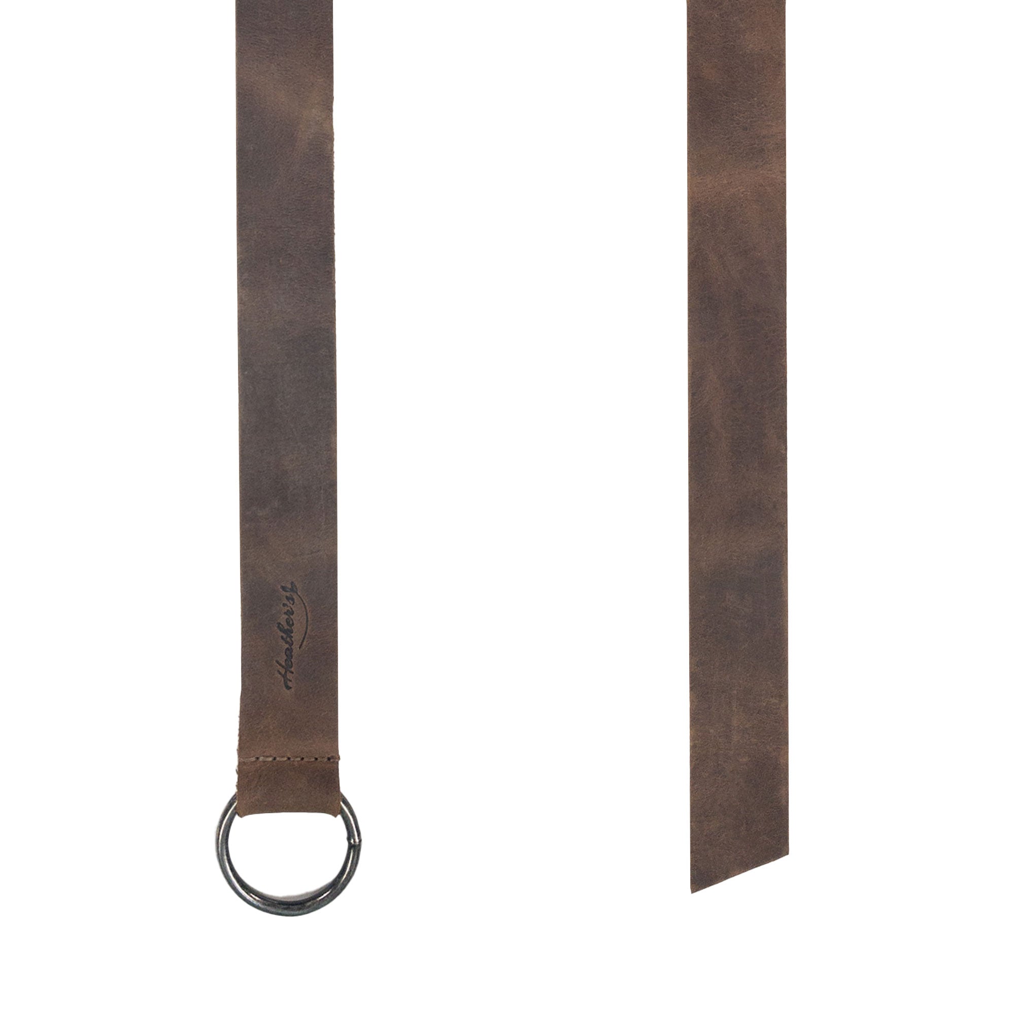 Close-up of the stitching and details on Heather's Ring Belt for Women, a no buckle waist belt crafted from full grain leather. A perfect blend of fashion and functionality, this handmade accessory is designed for versatility. Ring Belt for Women, No Buckle Waist Belt, Fashion, Adjustable, Full Grain Leather, Handmade Waist Accessory, Small Batch Production, Hand Cut, Hand Sewn, Fire Branded, Artisan, Handmade in La Antigua Guatemala & Oaxaca Mexico.