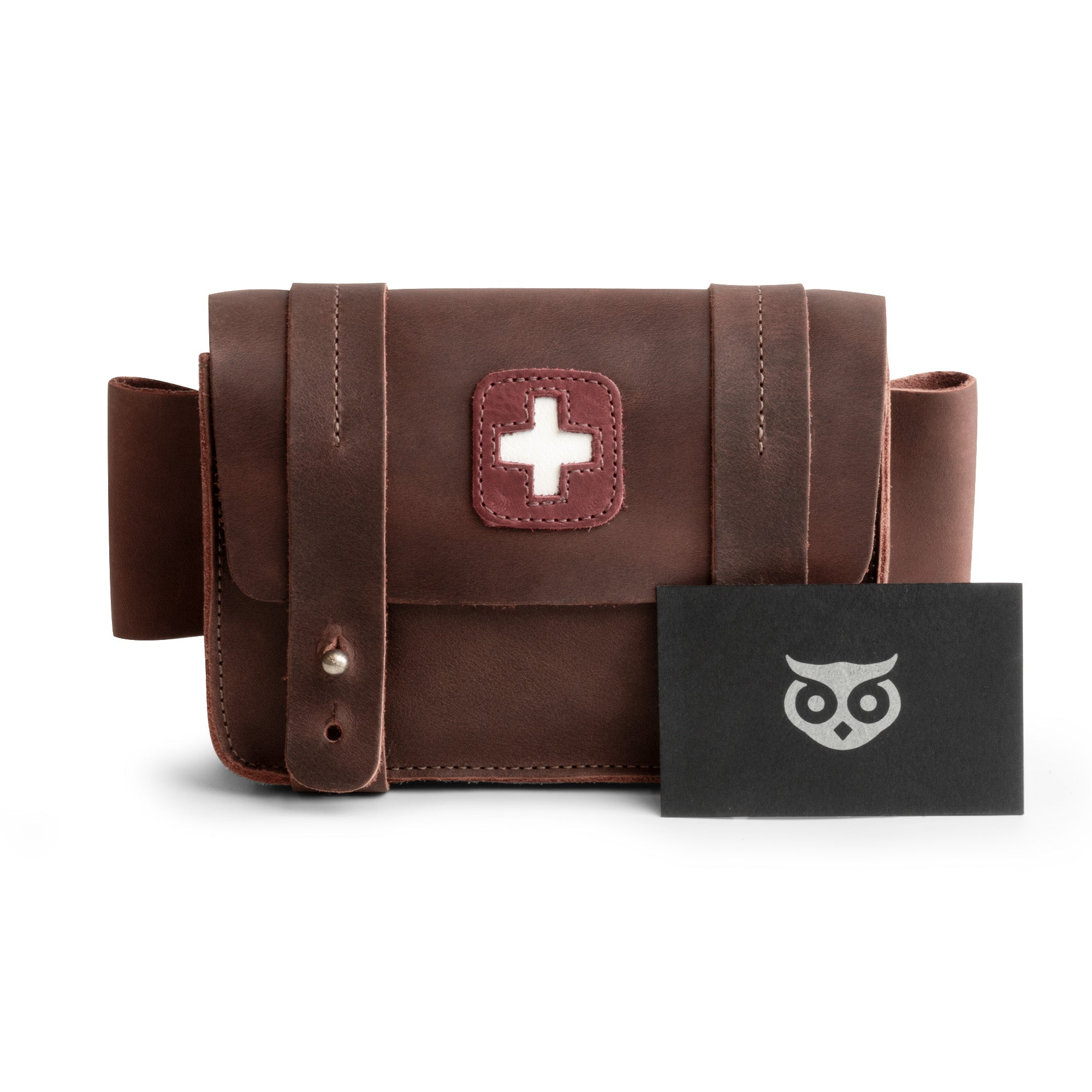 Hide & Drink's Empty First Aid Bag, Mini Medical Storage Pouch displayed with a gift card, reinforcing its appeal as a thoughtful gift. This Empty First Aid Bag is made from Full Grain Leather and serves as a practical organizer for small medic packs, showcasing artisan craftsmanship and small batch production from La Antigua Guatemala.