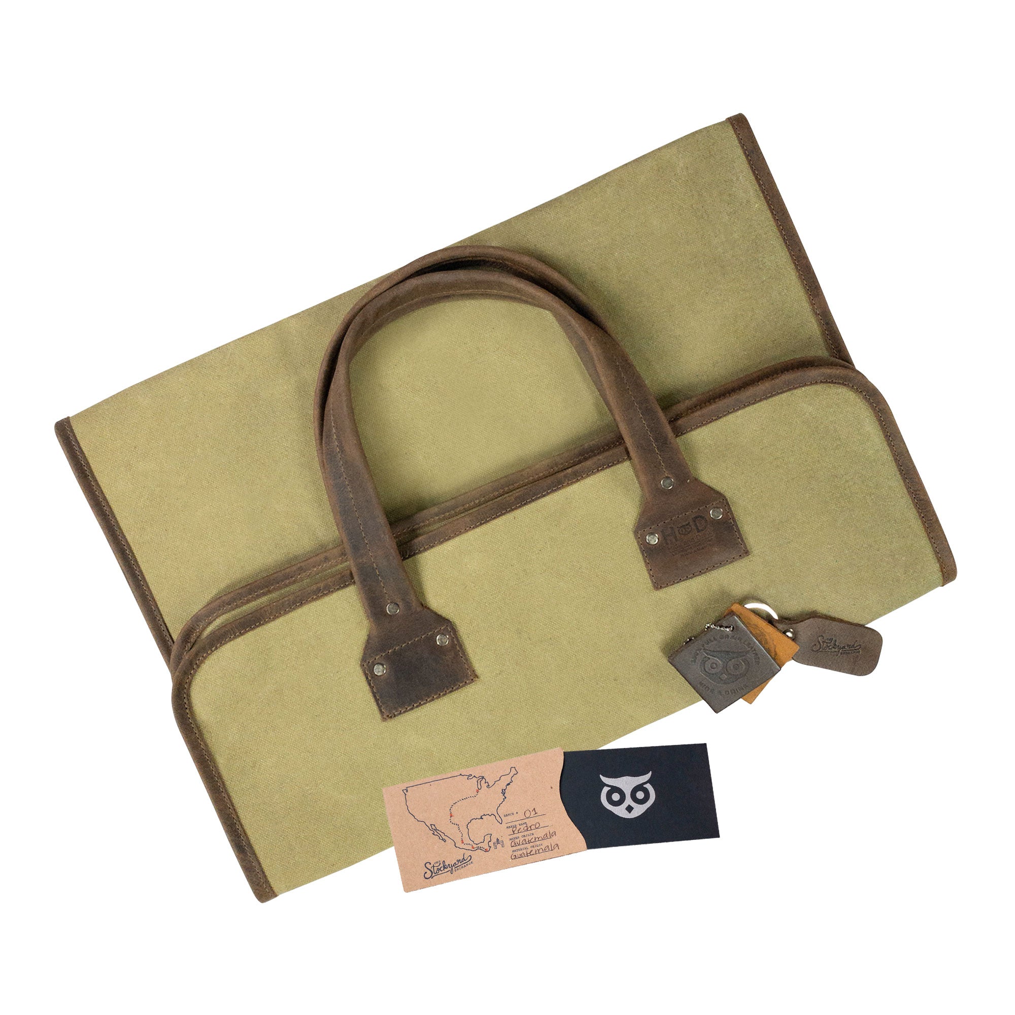 Hide & Drink Firewood Bag positioned flat, illustrating the spacious interior and classic construction that makes it an essential for wood transport. Firewood Bag With Leather Liner, Full Grain Leather, StockyardX, Small Batch Production, Hand Cut, Hand Sewn, Fire Branded, Artisan, Handmade in La Antigua Guatemala & Oaxaca Mexico.