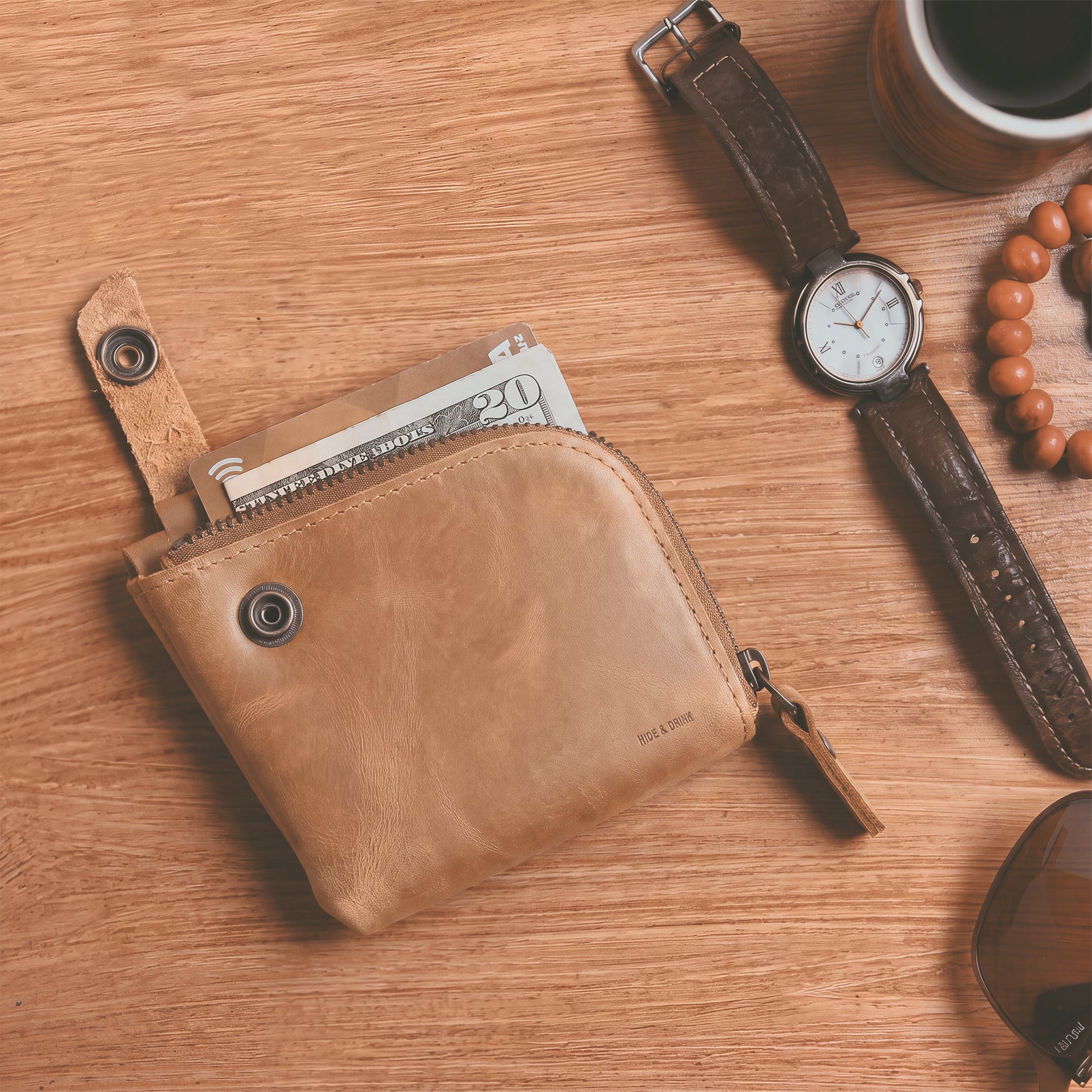 Lion's Mane Zippered Wallet by Hide & Drink demonstrating its ability to hold essentials comfortably, making it a great choice for daily use.