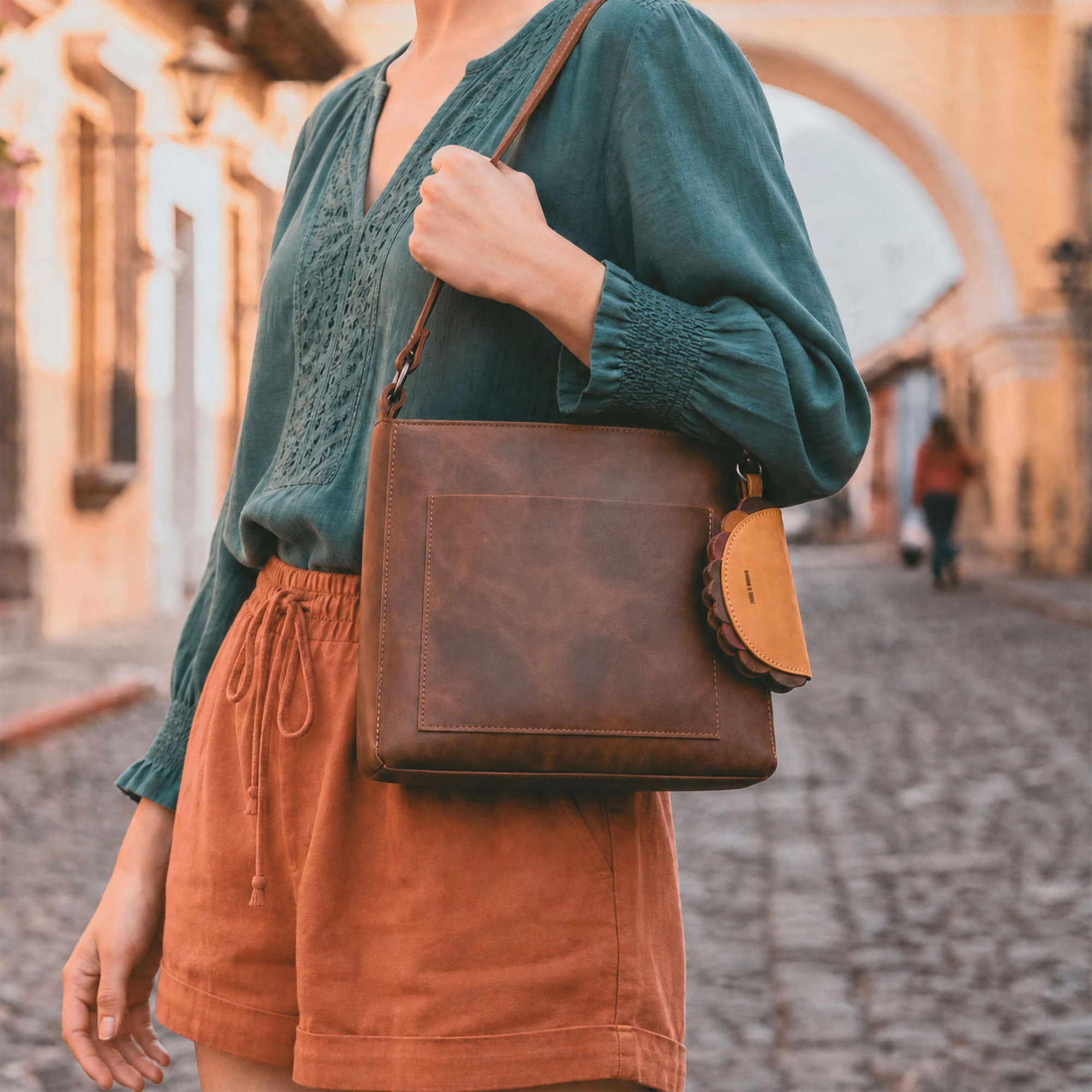Hide & Drink Taco Zip Pouch Bag Charm Key Chain displayed with its full grain leather construction, metal clip, and artisan brand logo alongside size measurements. Taco Zip Pouch Bag Charm Key Chain Full Grain Leather, StockyardX, Small Batch Production, Hand Cut, Hand Sewn, Fire Branded, Artisan, Handmade in La Antigua Guatemala & Oaxaca Mexico.