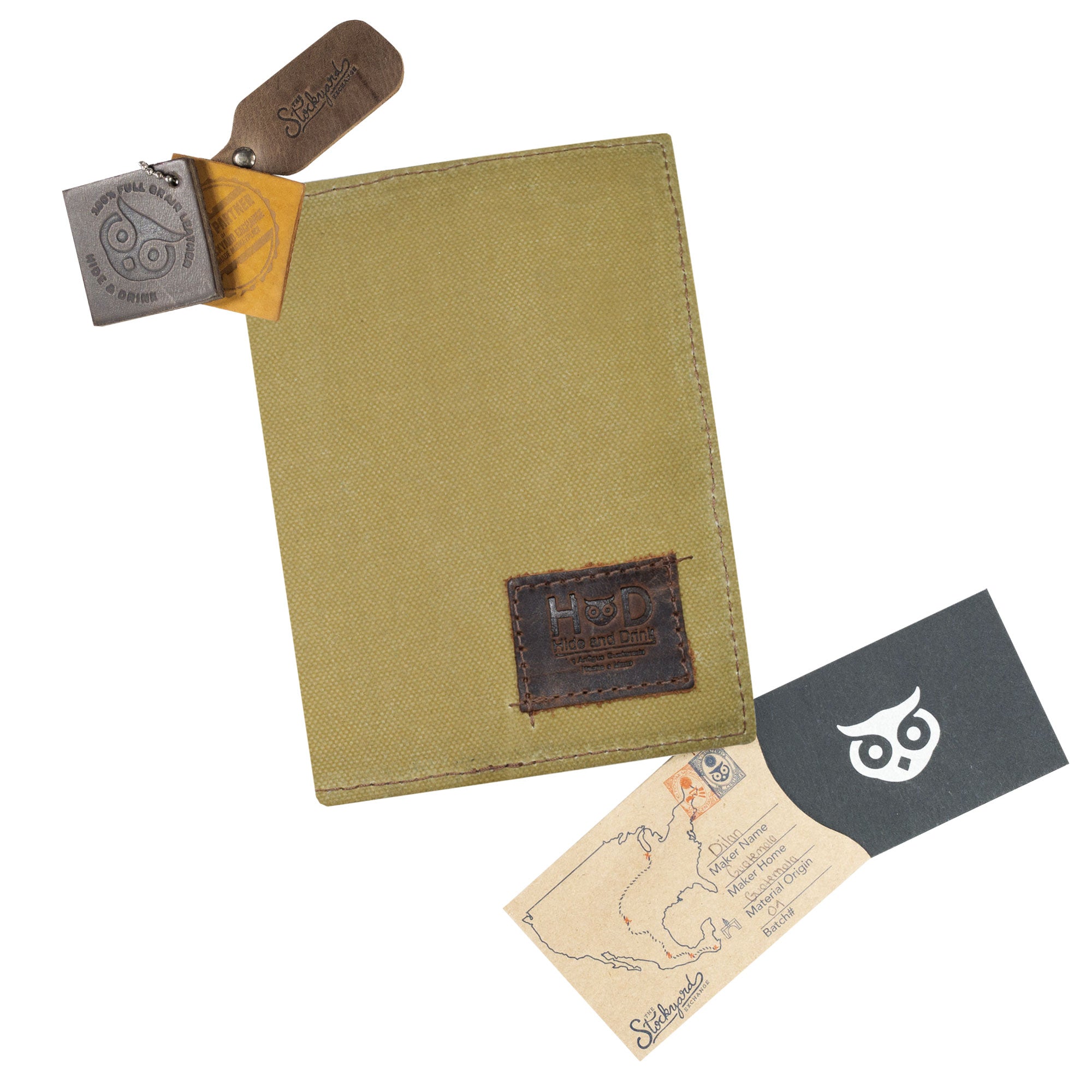 Hide & Drink Waxed Canvas Field Notes Cover with included accessories, including tags and information, highlighting its artisanal production. This cover is an essential companion for travelers, designed with a Wallet Case (3.5 x 5.5 in.) Journal Cover that complements your everyday adventures.