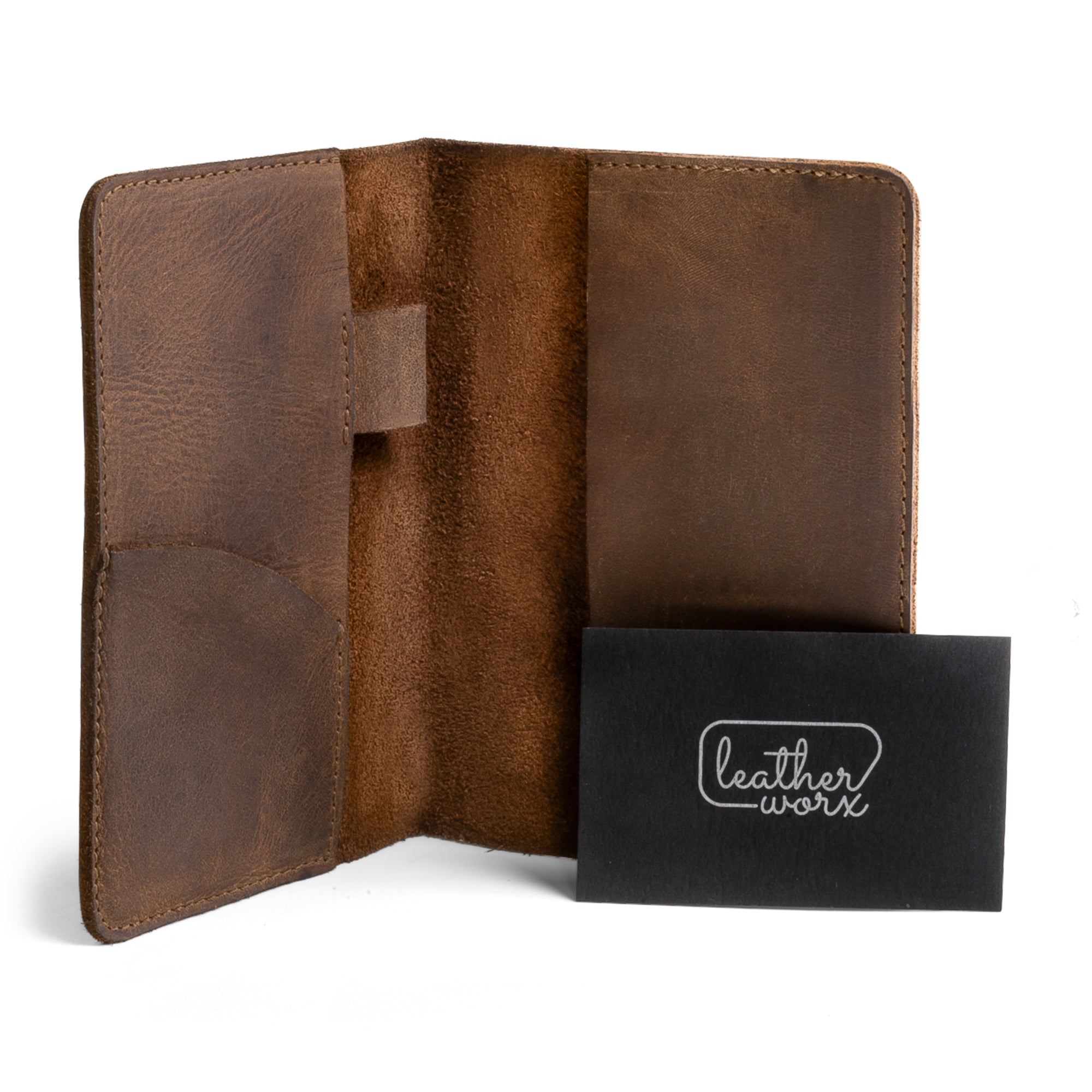 Presentation of the inside of a Field Notes Carrier by Leather Worx, featuring the logo card. This Field Notes Cover is a practical Leather Notebook Cover 3.5 x 5.5 in. with card and pen holder, perfect for travelers seeking reliable storage options. Handmade from full grain leather, its artisan qualities are indicative of small batch production from La Antigua Guatemala.