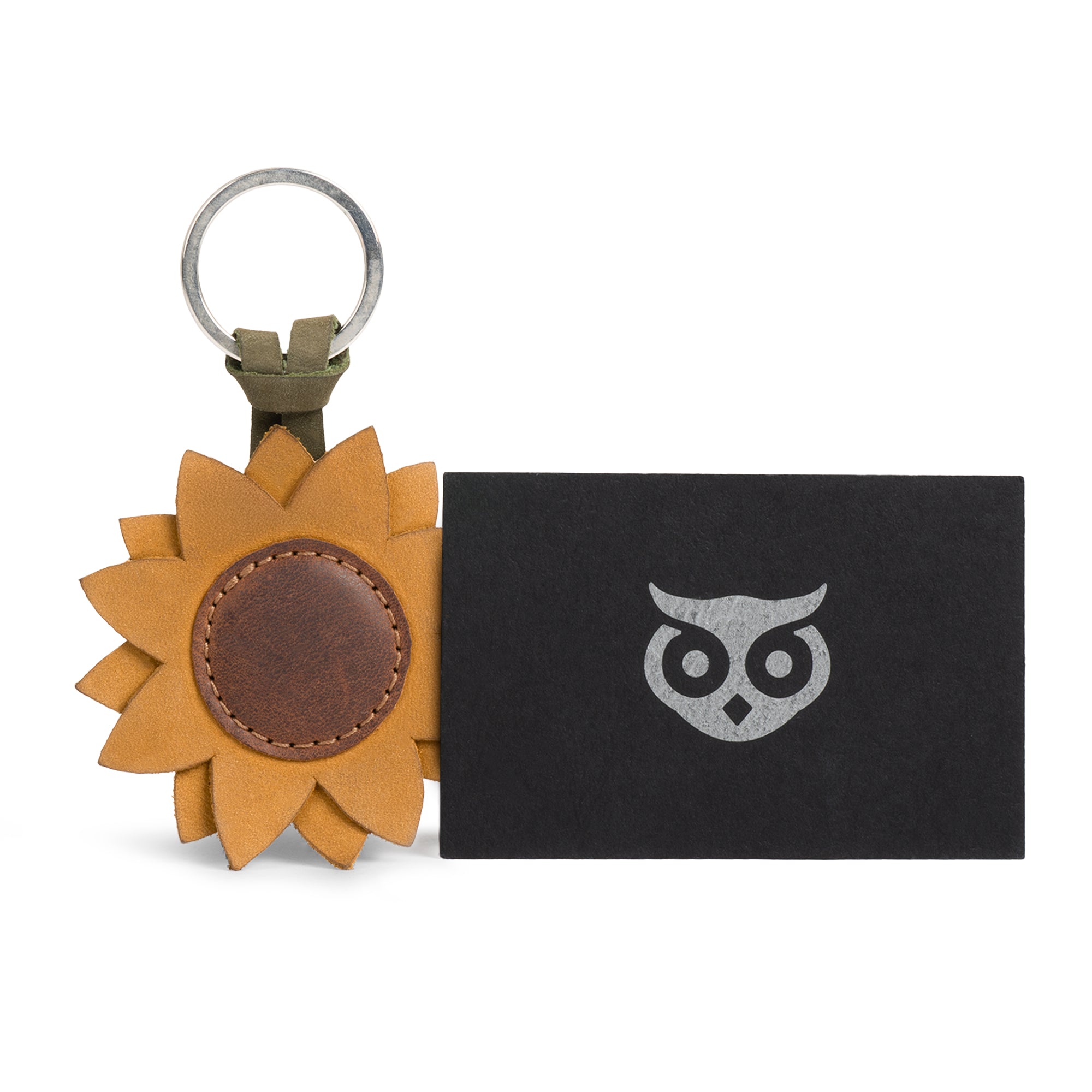 Sunflower Keychain from Hide & Drink presented creatively with packaging, emphasizing its stylish accessory nature, crafted from full grain leather, handmade for quality.