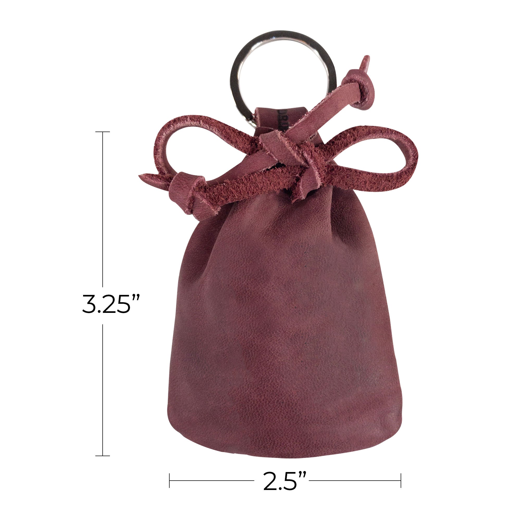 An artistic view of the Mini Medieval Pouch Keychain from Hide & Drink showcasing its stylish design in charcoal leather. This tiny bag with keyring serves as a perfect coin pouch, embodying artisan quality from La Antigua Guatemala.