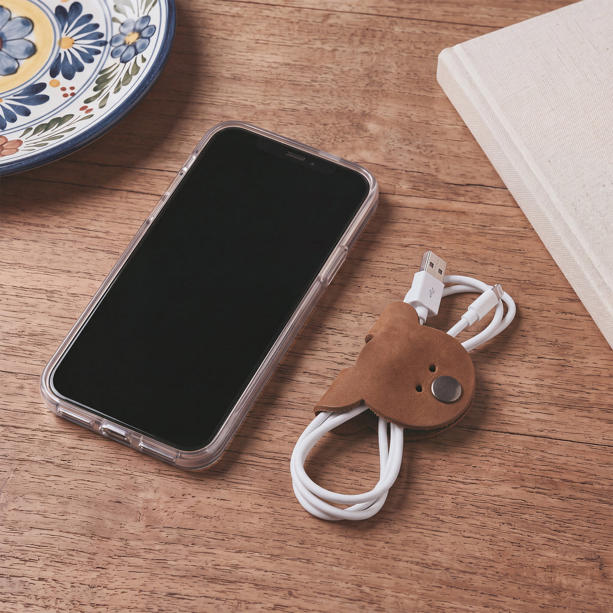 Bear Shaped Cord Keepers (Cord Clam) by Hide & Drink, perfect for organizing USB cords, crafted from durable Full Grain Leather with an artisan touch. Handmade in La Antigua Guatemala & Oaxaca Mexico, highlighting small batch production.