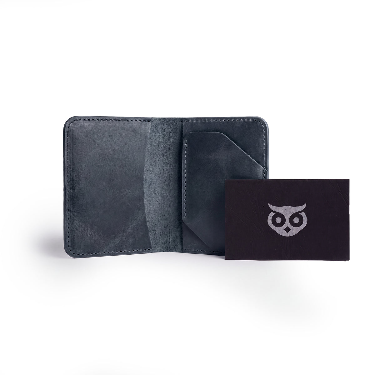 Navy Bi-Fold Card Wallet Diagonal by Hide & Drink displayed open, emphasizing its practical design for cards and cash organization, crafted from high-quality leather.