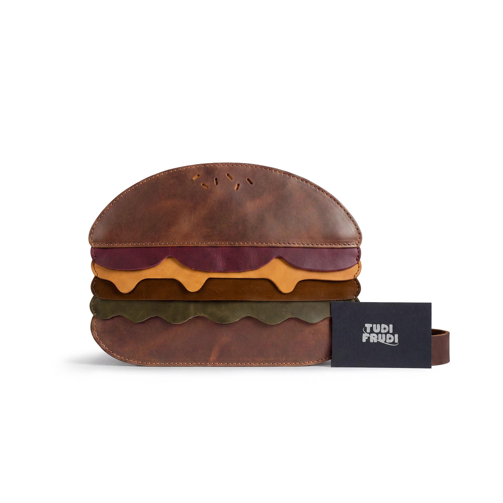 Burger-Shaped Shoulder Bag from Tudi Frudi presented with accompanying packaging, showcasing the unique artisan craftsmanship. This Full Grain Leather bag stands out as a fantastic Crossbody Bag or Messenger Bag, blending style with practicality. Handmade in La Antigua Guatemala & Oaxaca Mexico, it's a charming travel accessory from small batch production.