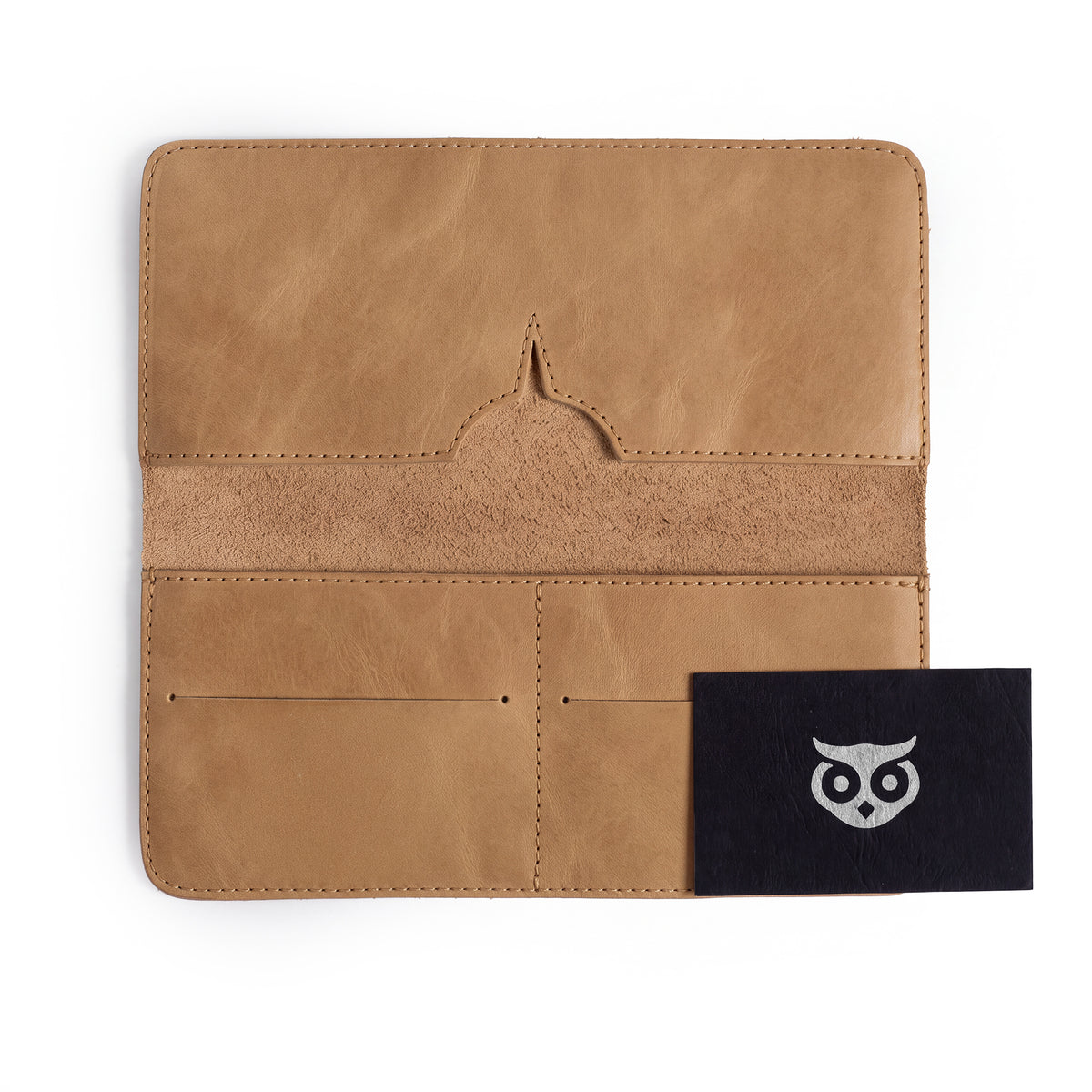 Open vintage bifold wallet for cellphone by Hide & Drink, highlighting card and cash compartments. This Bifold Wallet for Cellphone features durable Full Grain Leather for style and practicality. Experience the high-quality artisan craftsmanship achieved through small batch production in La Antigua Guatemala & Oaxaca Mexico.