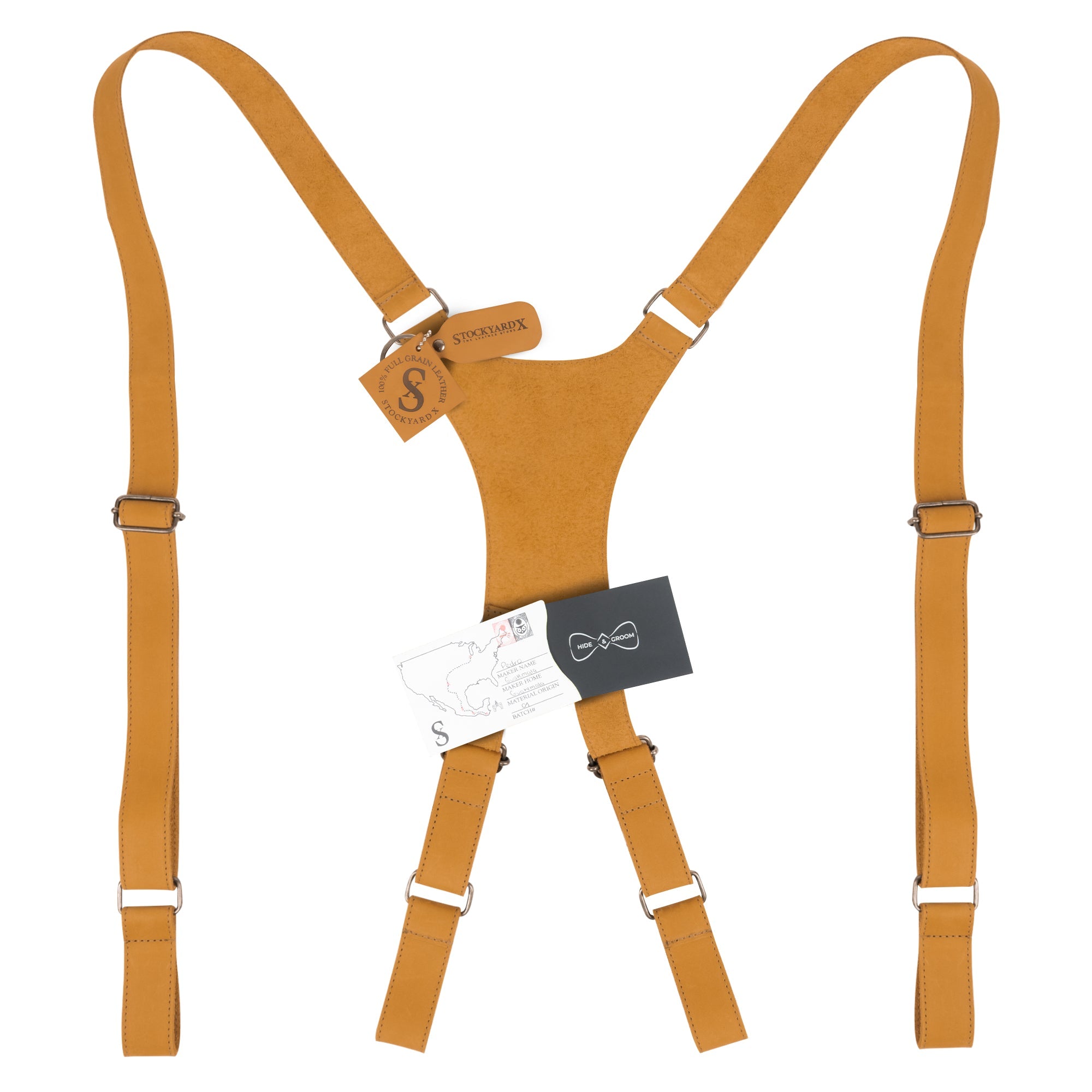 Yellow X Back Formal Suspenders by Hide & Groom with product tags, demonstrating artisan quality in full grain leather. Essential for formal occasions, they provide shoulder support as a wedding accessory. Each suspender is handmade in small batches, showcasing the craftsmanship of La Antigua Guatemala.
