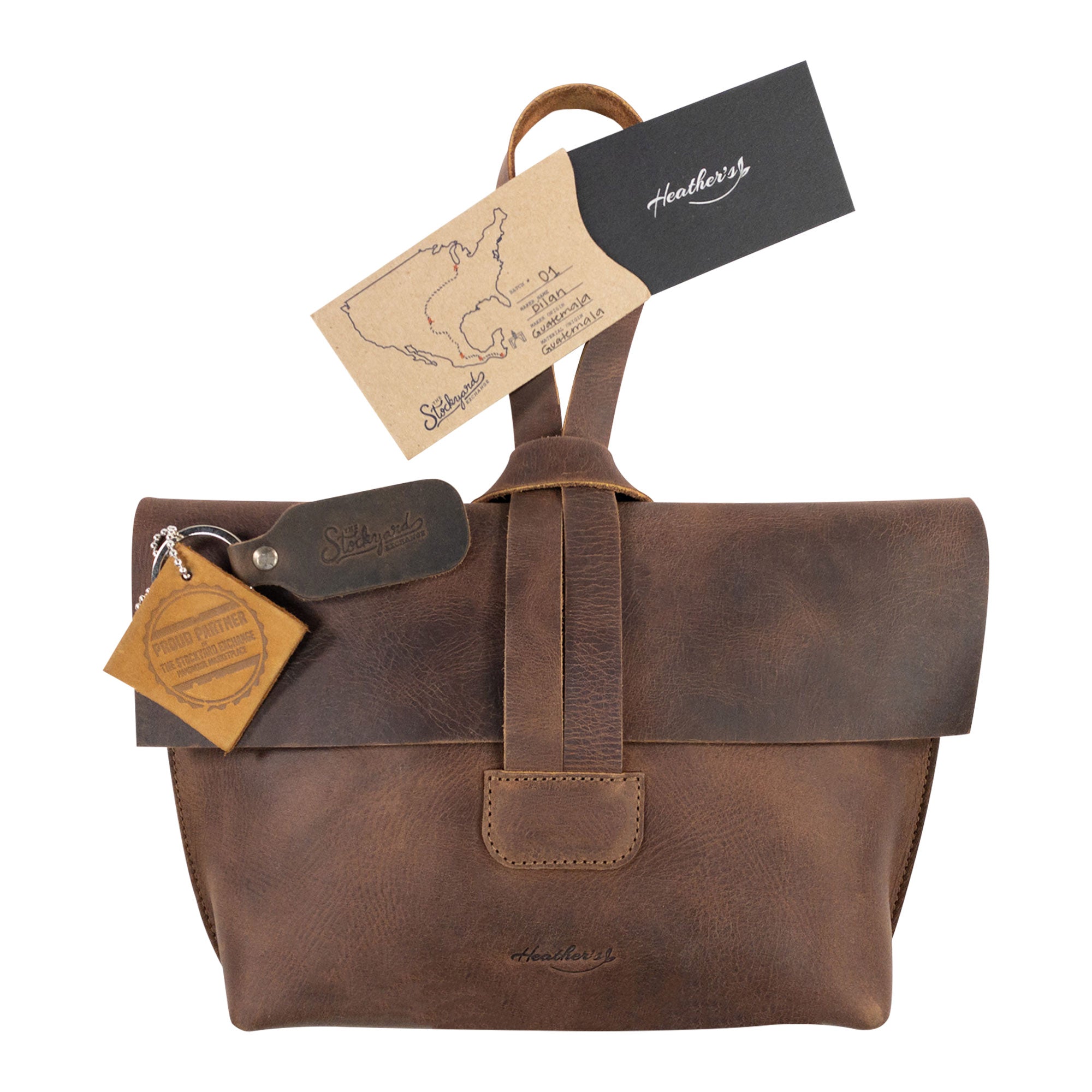 Women's Clutch Bag by Heather's, complete with a tag for authenticity and quality assurance. Crafted from Full Grain Leather in small batches, showcasing the artisan craftsmanship from La Antigua Guatemala, perfect for makeup and travel essentials.