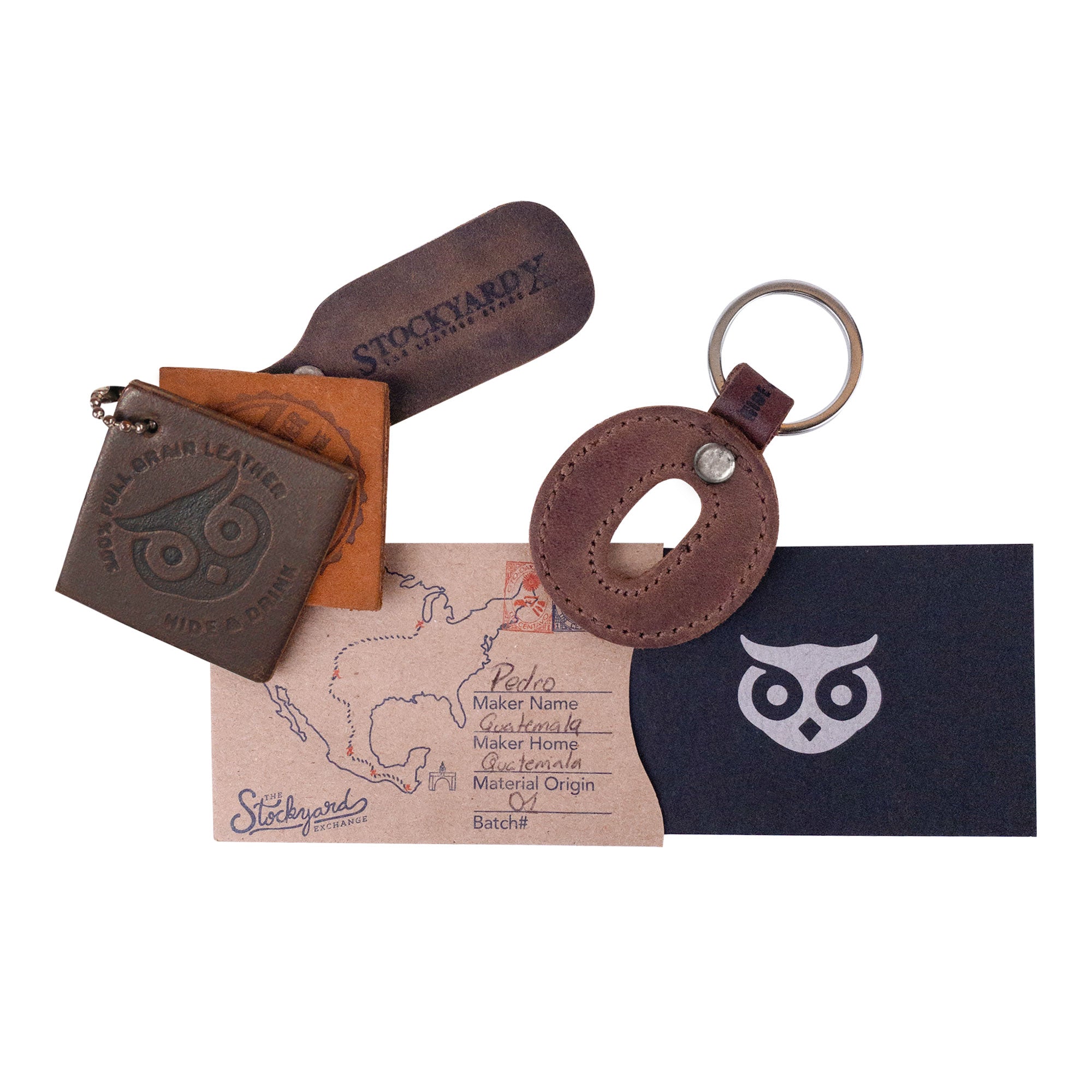 Assorted packaging materials alongside the letter O Alphabet Letter Keychain by Hide & Drink. This decorative piece, crafted with thick leather, embodies the artisanal methods of small batch production from La Antigua Guatemala.