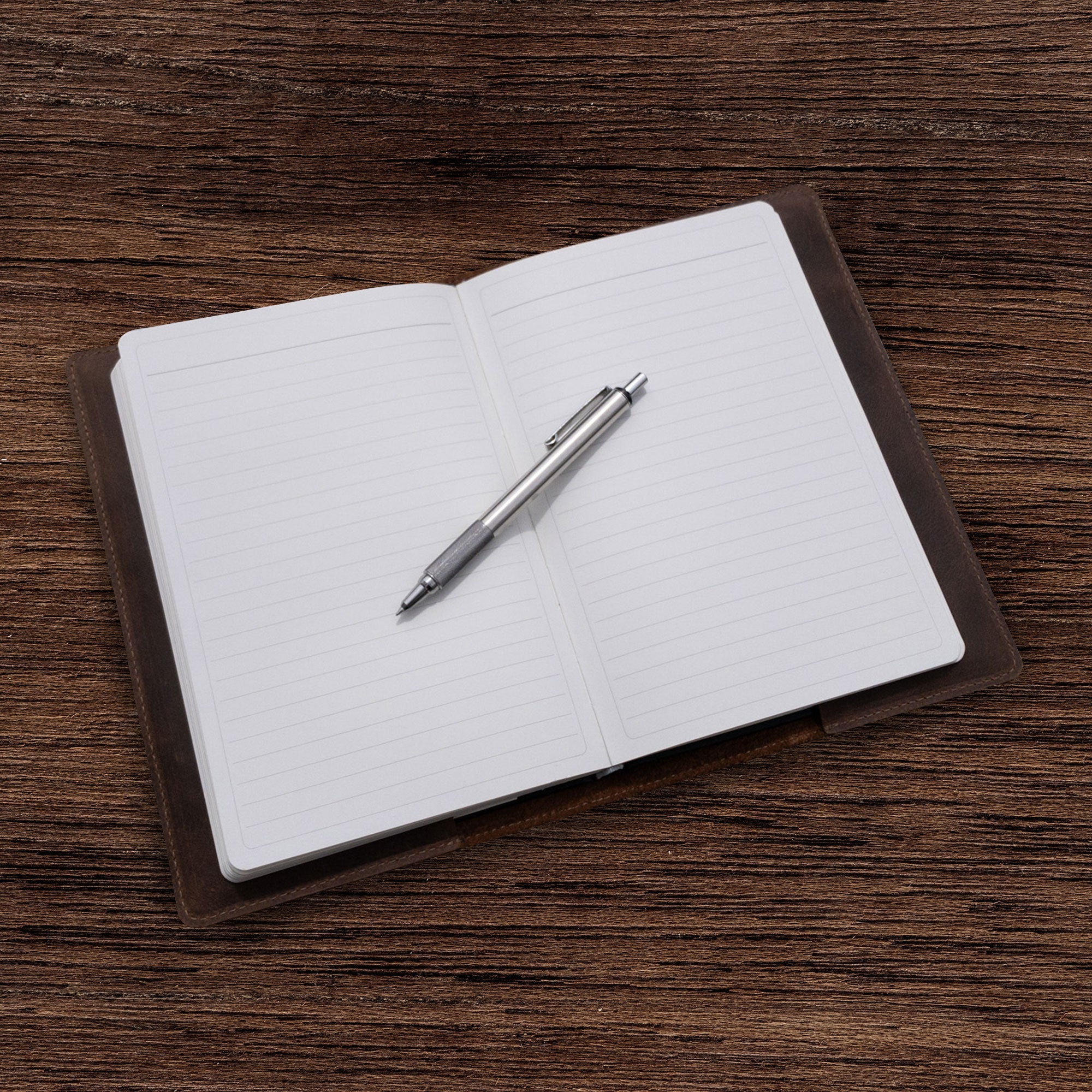 Interior view of the Rustic Journal Cover for Hardcover A5 Notebook by La Antigua, highlighting the soft leather protection and blank pages within. This case for the Hardcover Leuchtturm A5 (5.75 x 8.25 in.) Notebook is a must-have protective cover for your journal, combining functionality and style. Artisan-made, this writing accessory is an incredible gift choice that reflects small batch production quality.