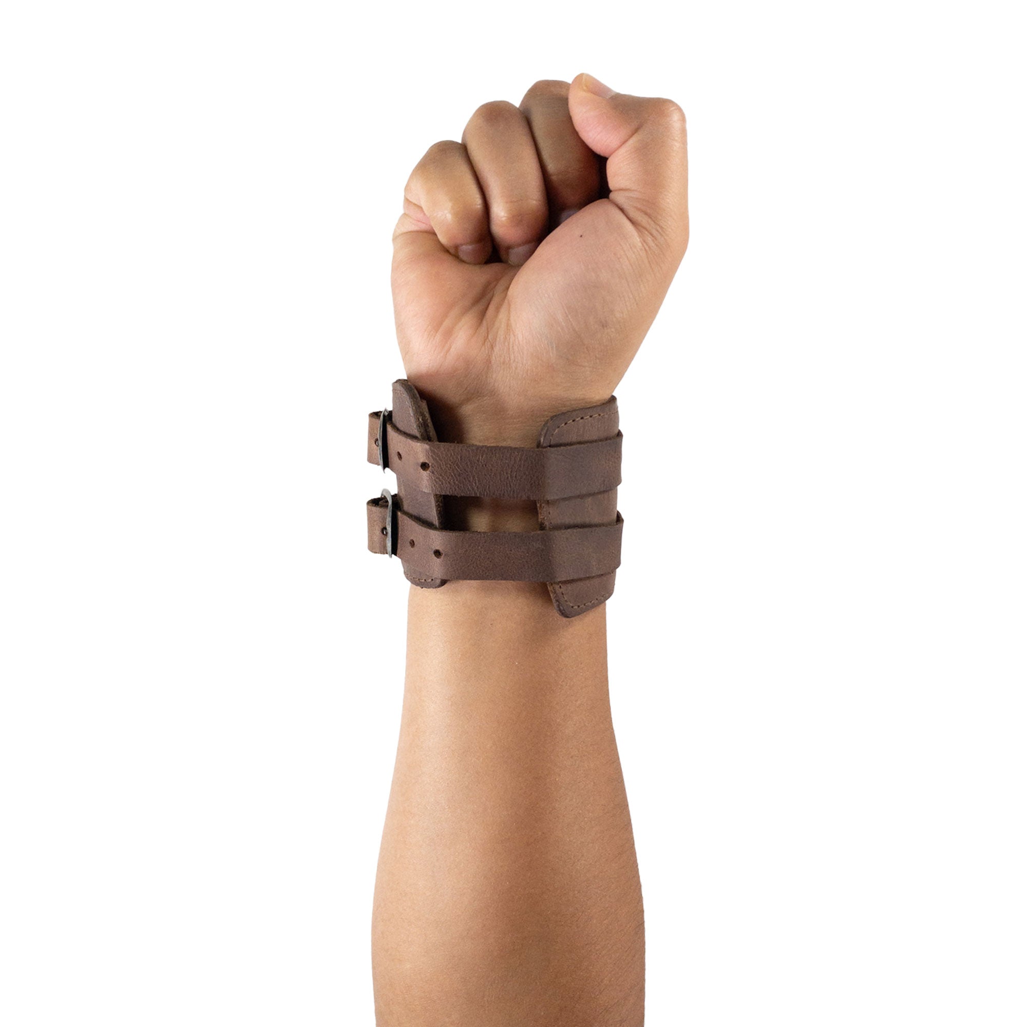 A close-up of Hide & Drink's Wrist-Wallet-Cuff emphasizes its thoughtful design in Full Grain Leather. This rustic leather bracelet is equipped with a hidden pouch for bills and an inner zippered pouch, making it a versatile accessory. Each wallet is handcrafted in La Antigua Guatemala & Oaxaca Mexico, showcasing small batch production and artisan techniques.