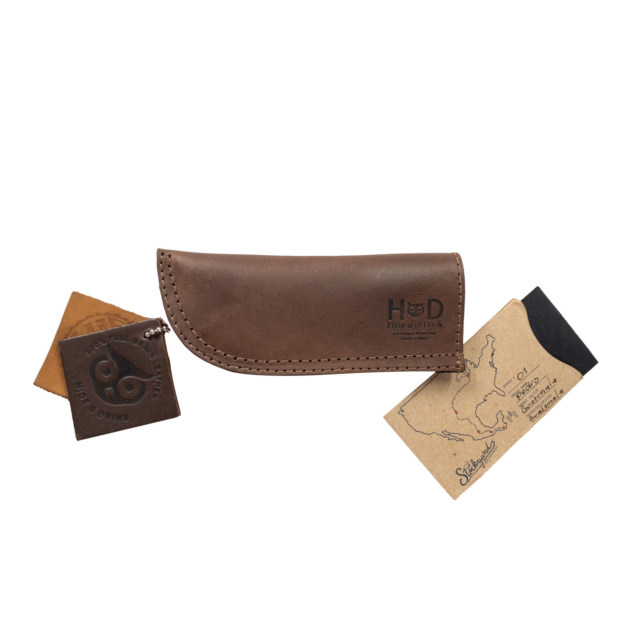 Hot Pan Handle Cover by Hide & Drink, highlighting luxurious full grain leather construction offering heat resistance and grip for cookware. Artisan-made in La Antigua Guatemala & Oaxaca Mexico.