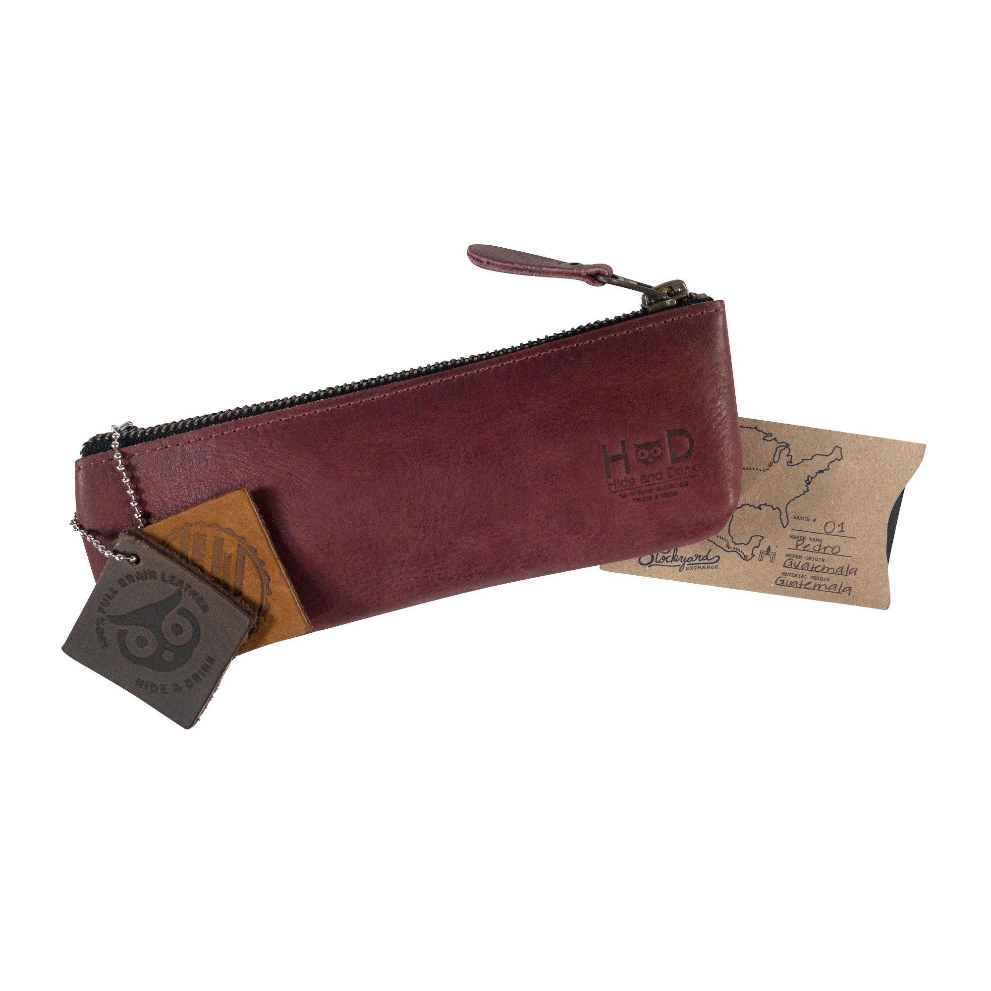Pencil Pouch by Hide & Drink, captured with care showing its classy design and tags. This Rectangular Pencil Case is a premium flat zippered holder made from full grain leather, perfect for artists and handmade in small batches in La Antigua Guatemala.