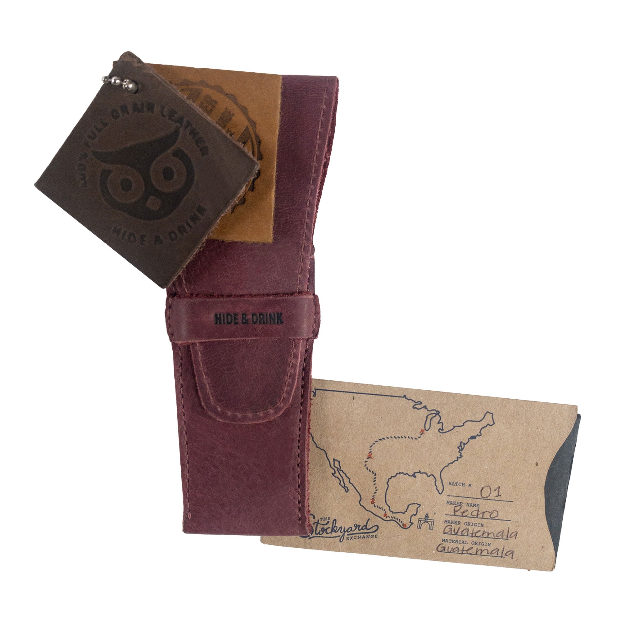 Hide & Drink's burgundy Safety Razor Case, complete with artisan tags that reveal its handmade origin and craftsmanship in La Antigua Guatemala and Oaxaca Mexico. An ideal companion for personal care, made from Full Grain Leather to enhance your shaving experience.