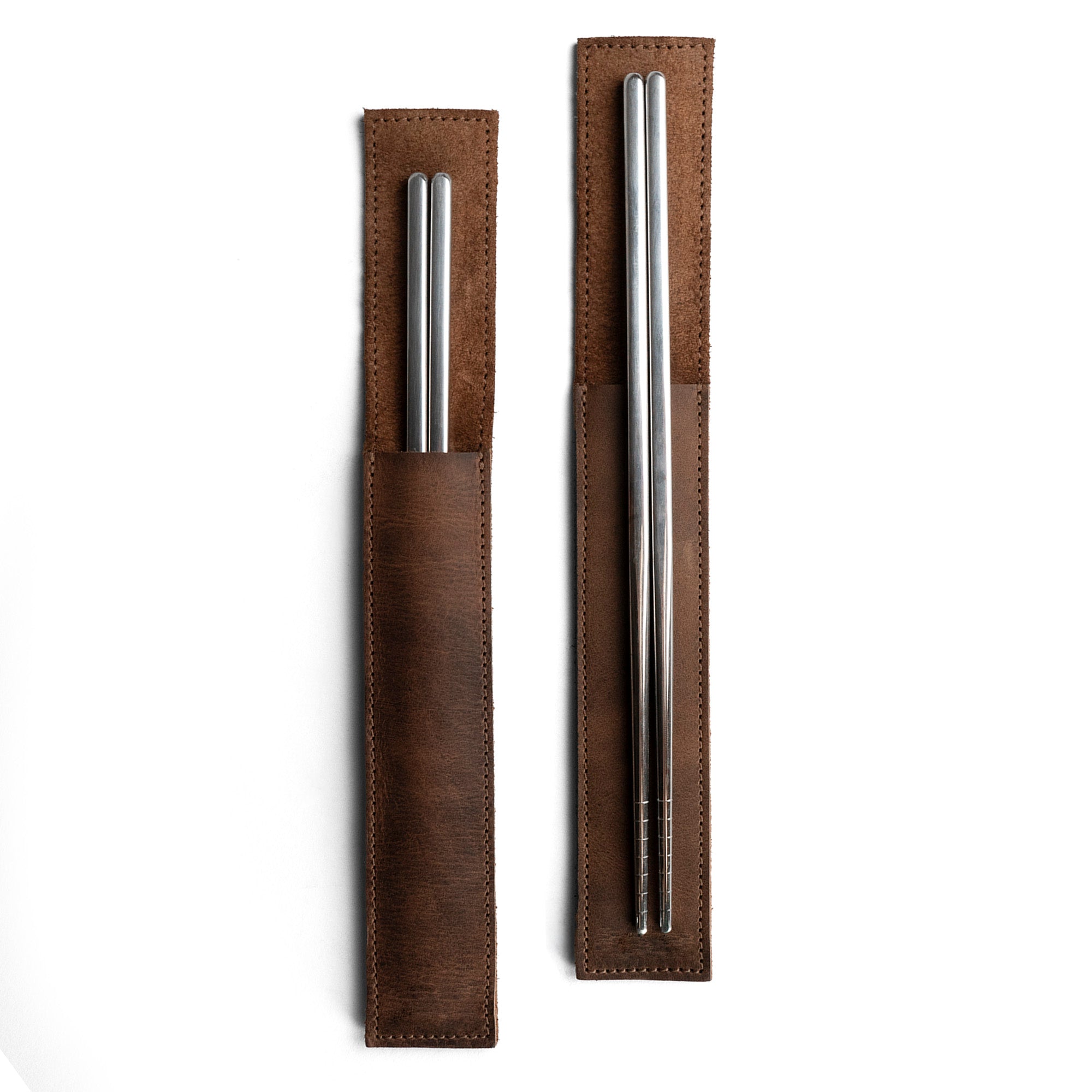 Elegant Set of 2 Rectangular Chopstick Holders by Cast Leather Co., showcasing full grain leather sleeves designed for bamboo wooden Chinese chopsticks. Perfect for keeping utensils organized and clean, this handmade artisan product features hand cut and hand sewn details made in La Antigua Guatemala.