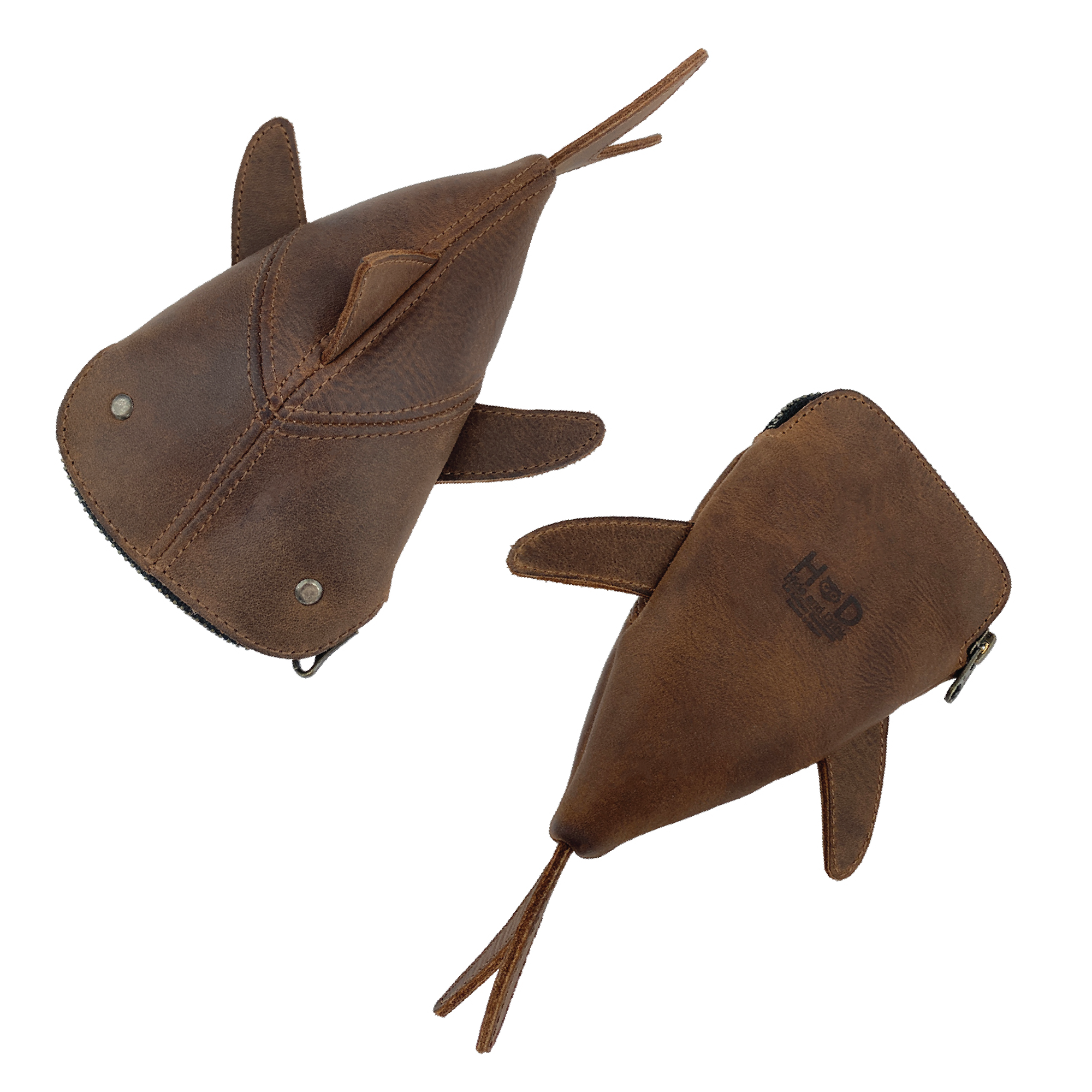 Image of the brown Leather Shark Pouch from Hide & Drink, filled with various pens and scissors. This zippered coin pouch serves as a practical shark shaped case, showcasing full grain leather quality. Artisan produced in small batches in La Antigua Guatemala & Oaxaca Mexico, it epitomizes careful hand cutting and sewing.