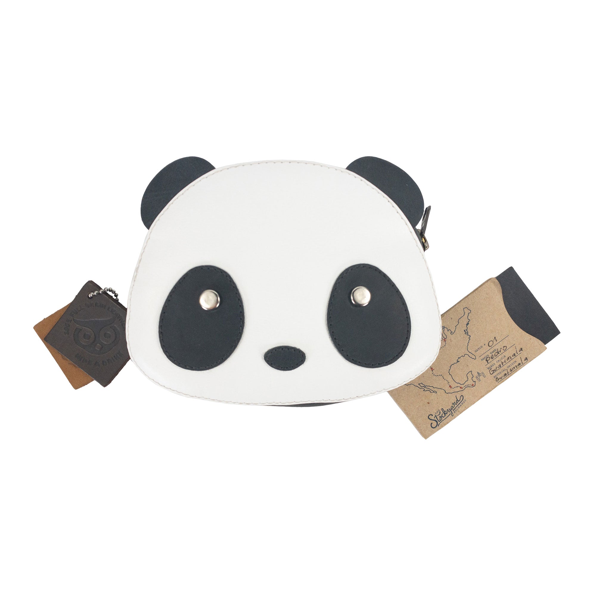 The Panda Head Shape Wallet by Hide & Drink is pictured with tags, showcasing its unique panda face design. A perfect choice for cash, cables, cards, and travel accessories, this Full Grain Leather wallet reflects artisan quality through hand cut, hand sewn details and is fire branded, made in La Antigua Guatemala & Oaxaca Mexico.