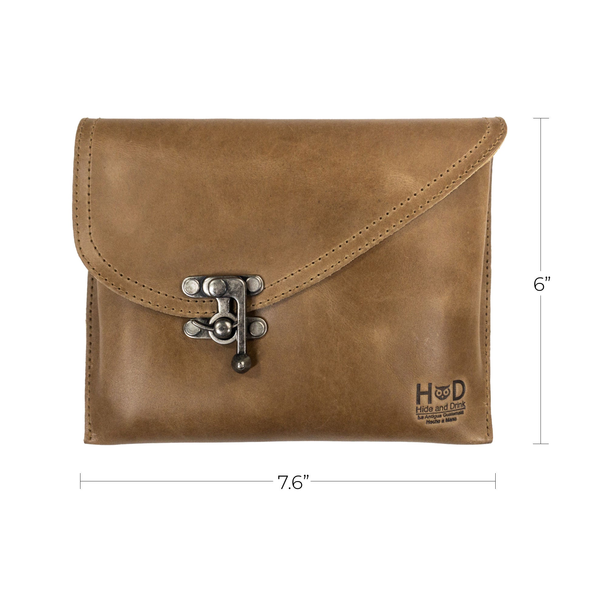 Dimensions of the tan Petite Vintage Clutch Bag by Hide & Drink, measuring 7.6" x 6". This elegant evening bag and travel accessory is handcrafted from full grain leather, exemplifying artisan quality from small batch production in La Antigua Guatemala & Oaxaca Mexico.