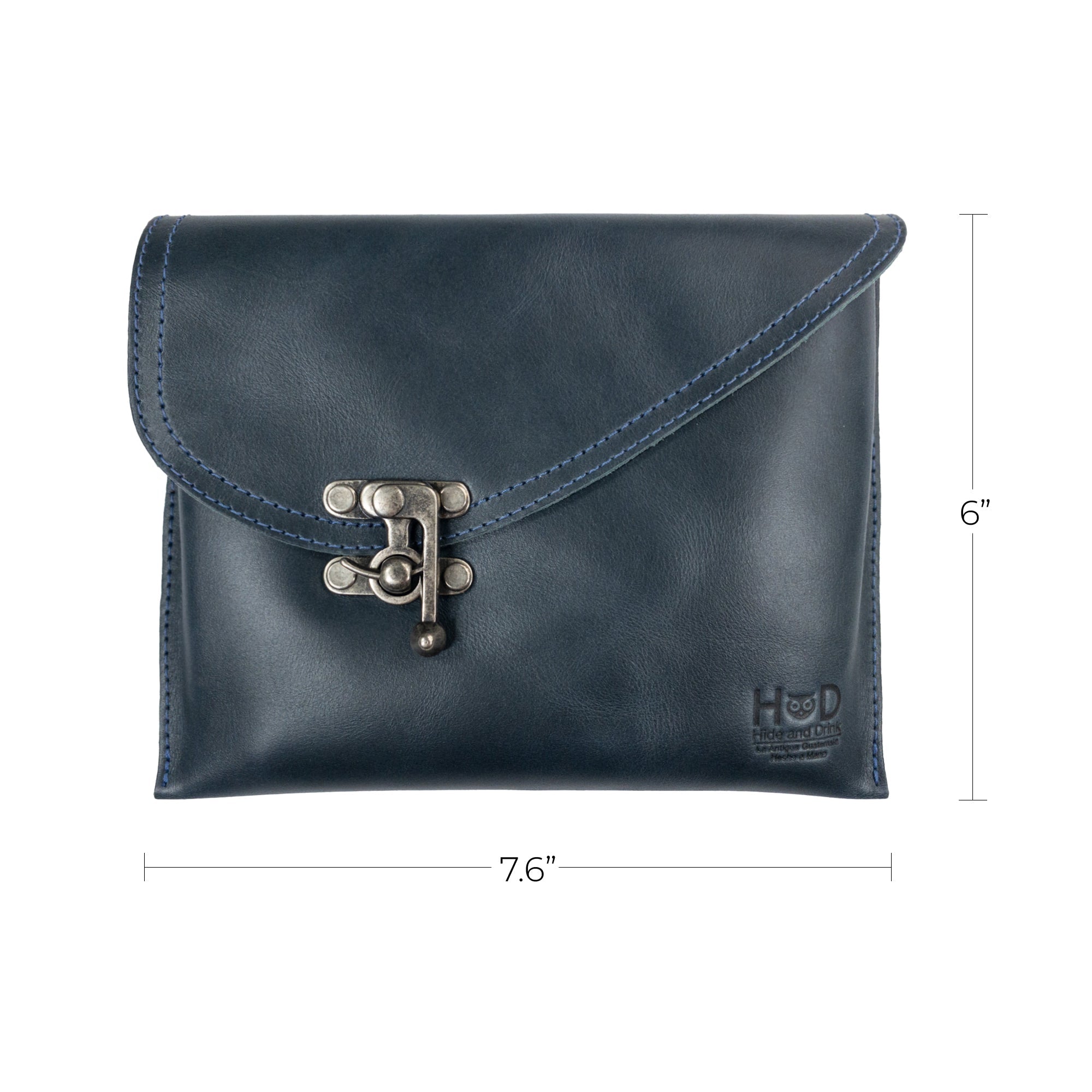 Dimensions of the navy Petite Vintage Clutch Bag by Hide & Drink, measuring 7.6" x 6". This handmade evening bag crafted from full grain leather serves well as a stylish travel accessory, emphasizing artisan craftsmanship from La Antigua Guatemala & Oaxaca Mexico.