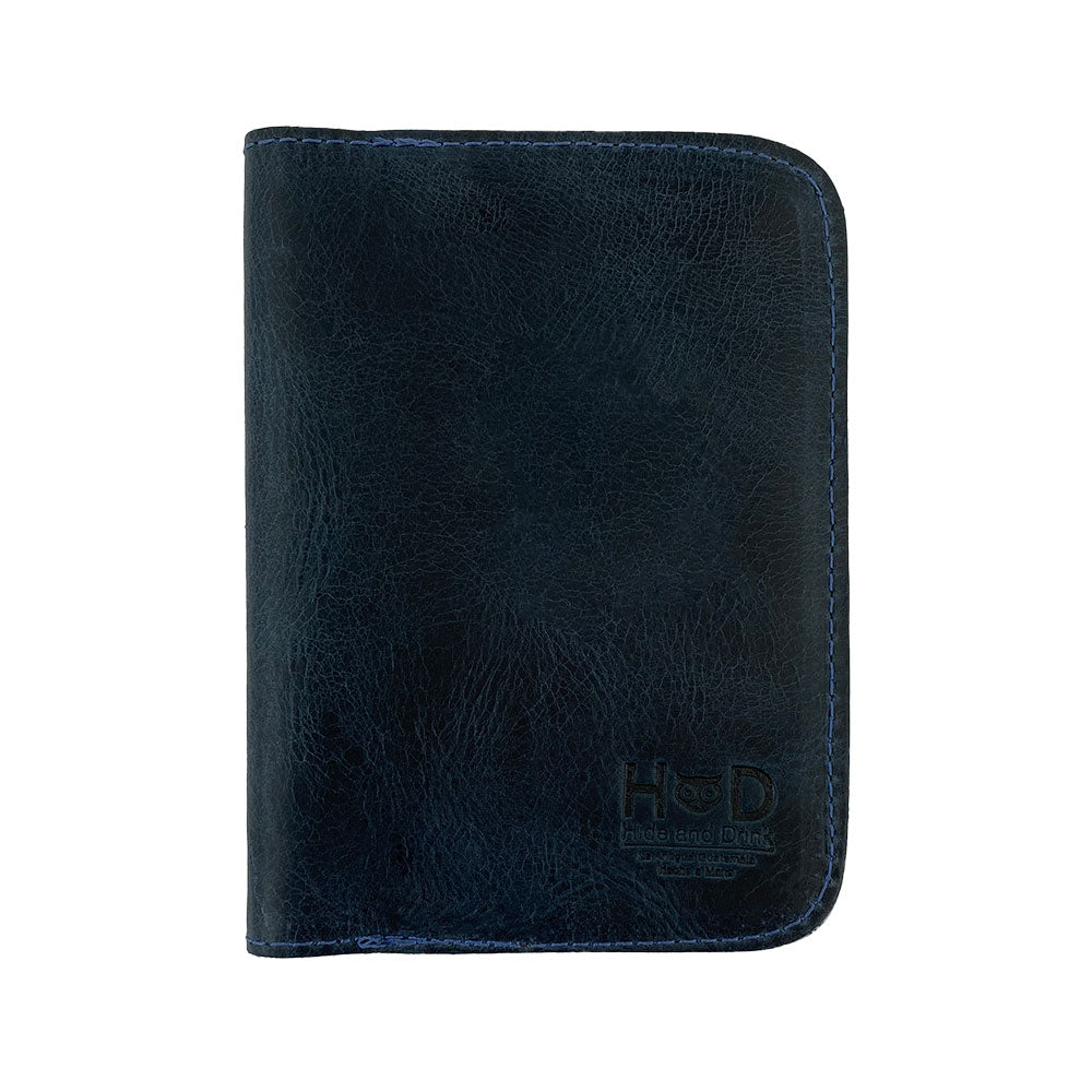 Front view of a color option of the Hide & Drink Travel Wallet, exemplifying its vintage look. This travel wallet serves as a bifold passport case, beautifully made from premium leather in La Antigua Guatemala.