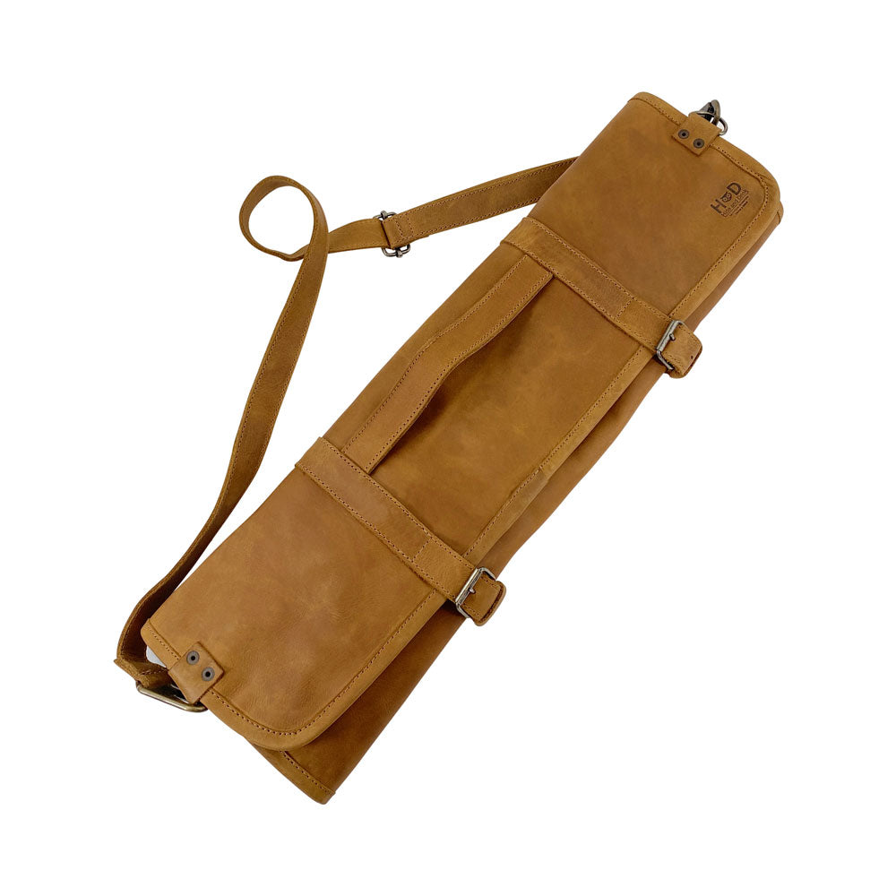 Hide & Drink Knife Roll With Water Resistant Lining (8 Pockets) in tan leather. Ideal as a Chef's Knife Roll Bag (8 Pockets), this portable knife organizer offers style and functionality for cooking accessories.