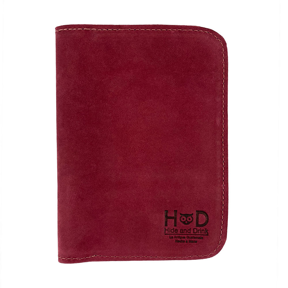 Front view of the Hide & Drink Travel Wallet in a rich leather hue. This artisan-crafted travel wallet is an ideal bifold passport case, made from premium leather in La Antigua Guatemala.
