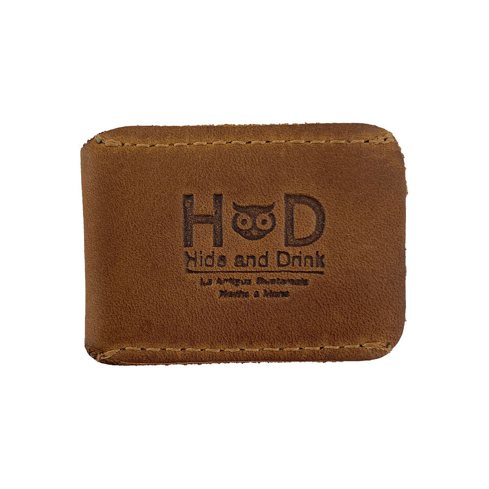 Razor Head Cover by Hide & Drink in a classic brown full grain leather version, designed to protect double edge safety razors. This elegant protective sheath acts as a shaving travel cover, showcasing the artisan craftsmanship, small batch production, hand cut, hand sewn, and fire branded features, handmade in La Antigua Guatemala & Oaxaca Mexico.