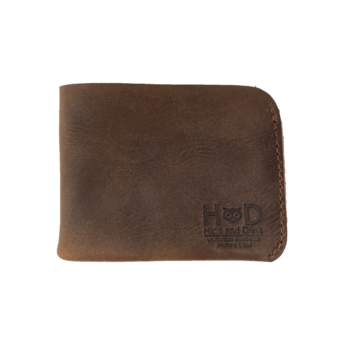Exterior view of the Hide & Drink Minimal Wallet with a vintage look, identified as a Full Grain Leather Classic Slimfold Wallet. This Card Organizer Holder embodies a Travel Accessory with its Small Batch Production quality. Crafted from premium materials, it’s an Artisan, Handmade item from La Antigua Guatemala & Oaxaca Mexico.