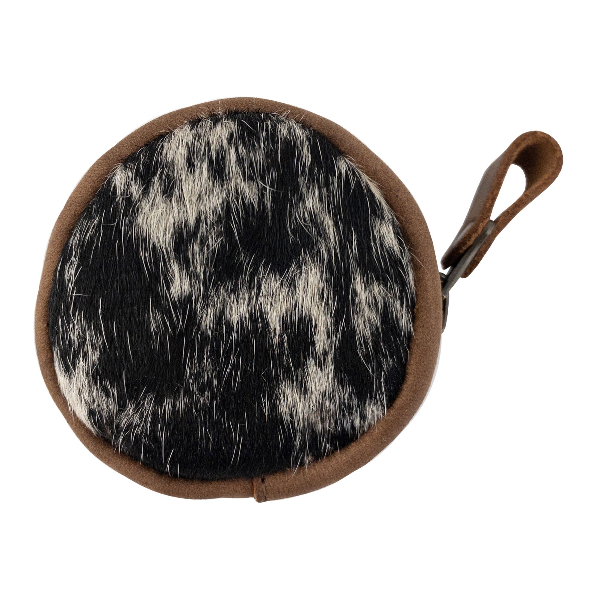 Top view of the Rounded Coin Case by Western Leather Works, highlighting its distinctive hair-on-hide pattern and soft feel. This artisan-made wallet is ideal for organizing coins and other small items, perfectly fusing style with practicality as a travel and commuter accessory. Each piece is made with care in La Antigua Guatemala, emphasizing hand crafted excellence.