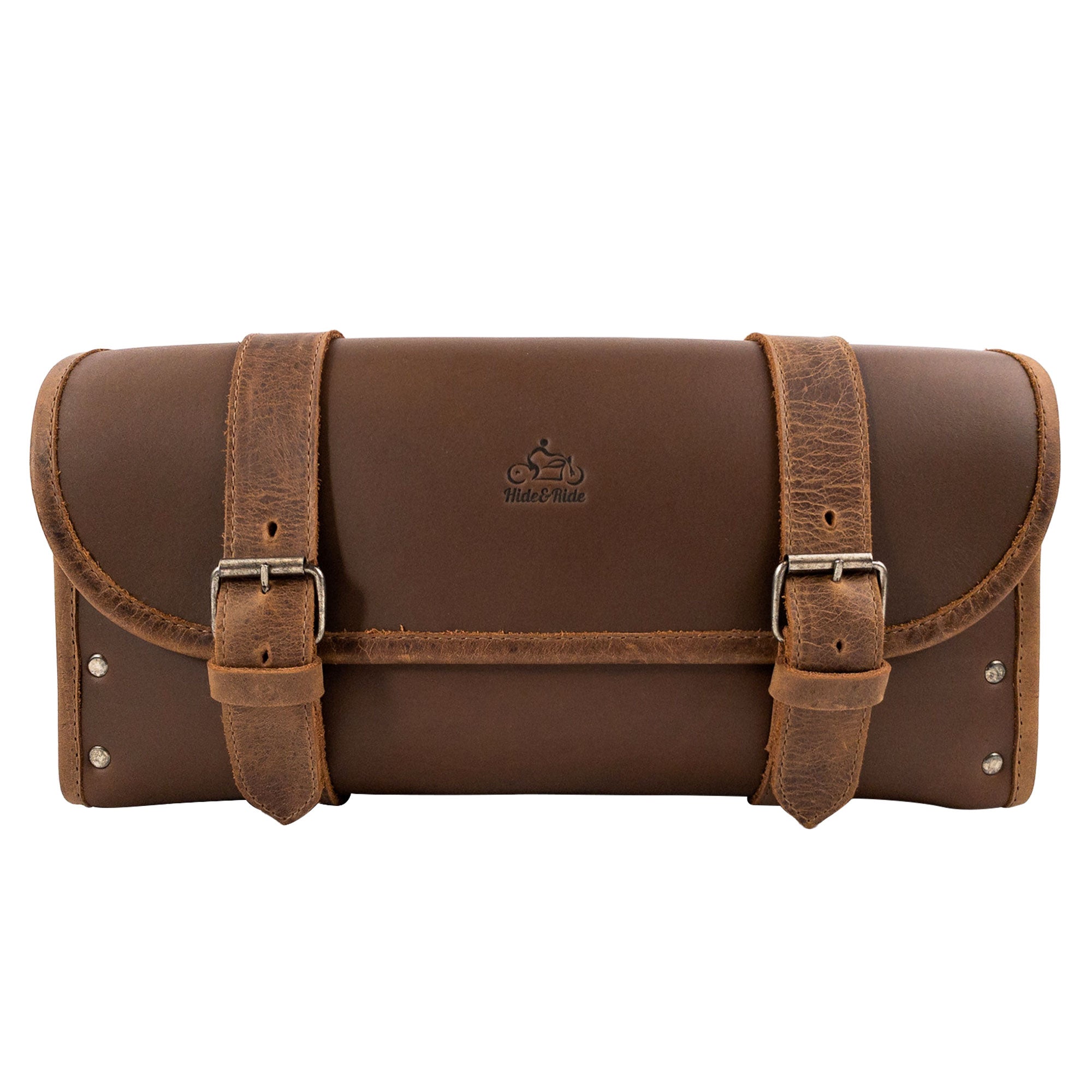 Front view of the Riveted Bag for Motorcycle by Hide & Ride showcasing sturdy adjustable belts, large capacity, and detailed craftsmanship in full grain leather. This Motorcycle Riveted Bag is ideal for bikers and features small batch production methods, handcrafted in La Antigua Guatemala & Oaxaca Mexico.