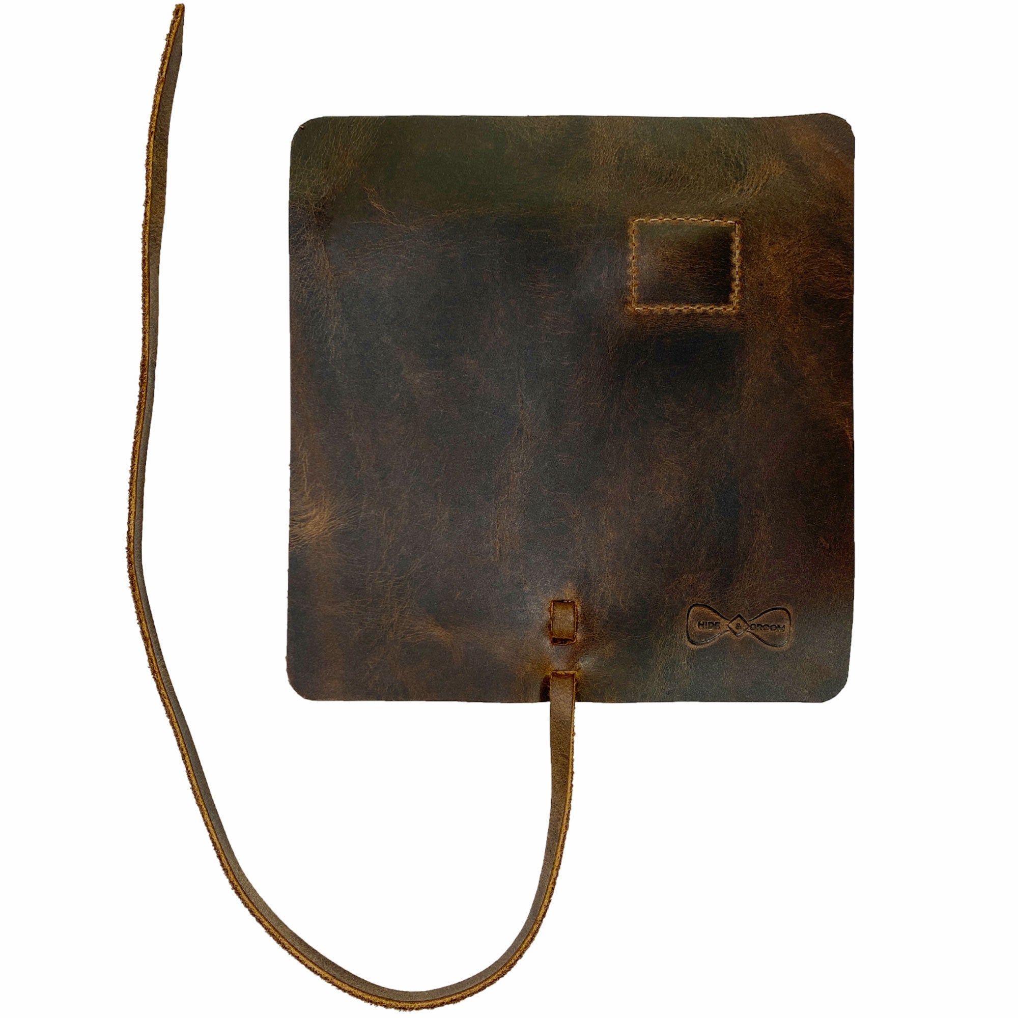 Hide & Groom Shaving Brush Roll crafted from full grain leather, ideal toiletry organizer for travel and grooming essentials. This minimalist style roll, handmade in La Antigua Guatemala, exemplifies artisan quality with small batch production. It features hand cut and hand sewn elements, fire branded for authenticity, making it a unique personal care item.