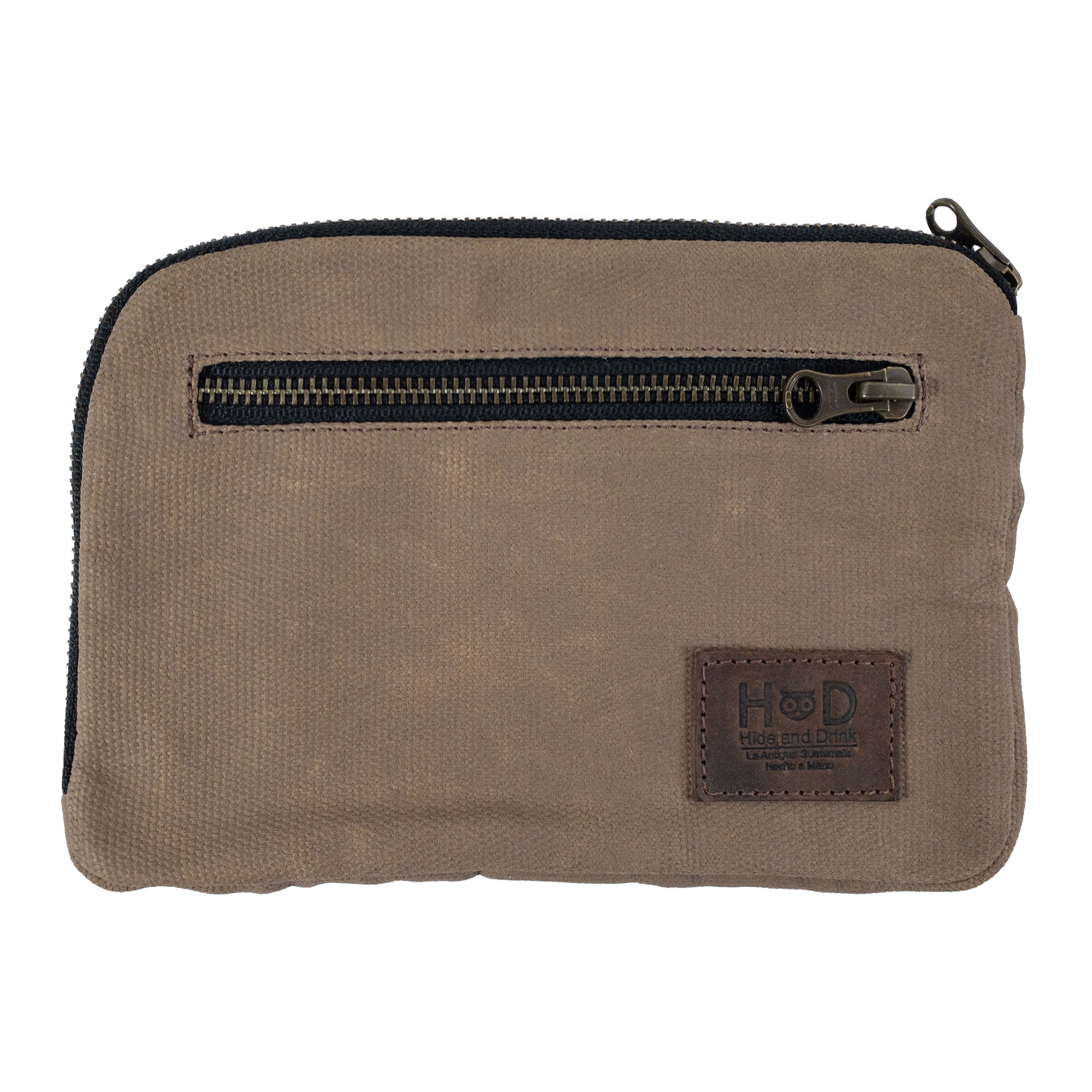 Hide & Drink's Zipper Gear Pouch in a brown color variant, showcasing its sleek zipper design and practical use as a camping bag made from water resistant waxed canvas.