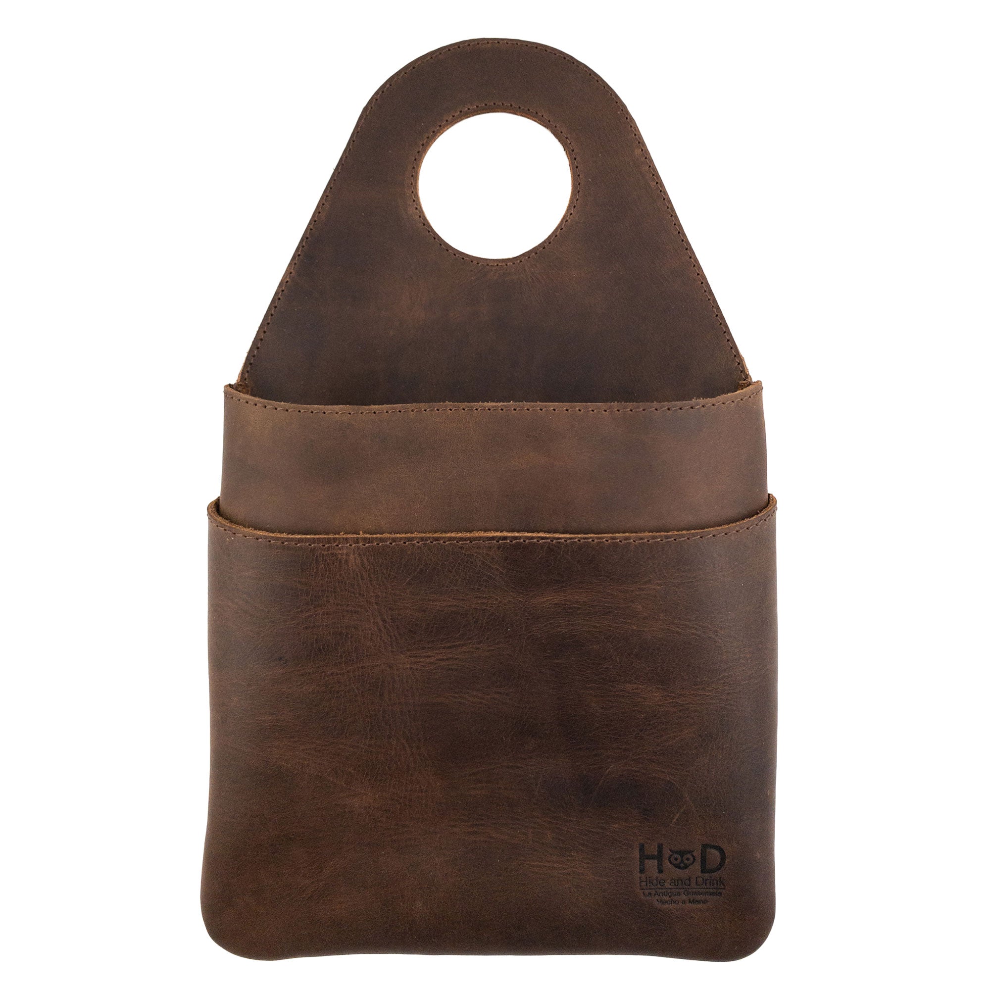 Hide & Drink's Seat Side Organizer for Gear Stick made from durable Full Grain Leather, perfect for keeping your essentials organized. This holder for charges, cables, and more is an outdoor protector for your knife, featuring handmade craftsmanship in small batch production. Hand cut, hand sewn, and fire branded, this organizer is an artisan piece, handmade in La Antigua Guatemala & Oaxaca Mexico.