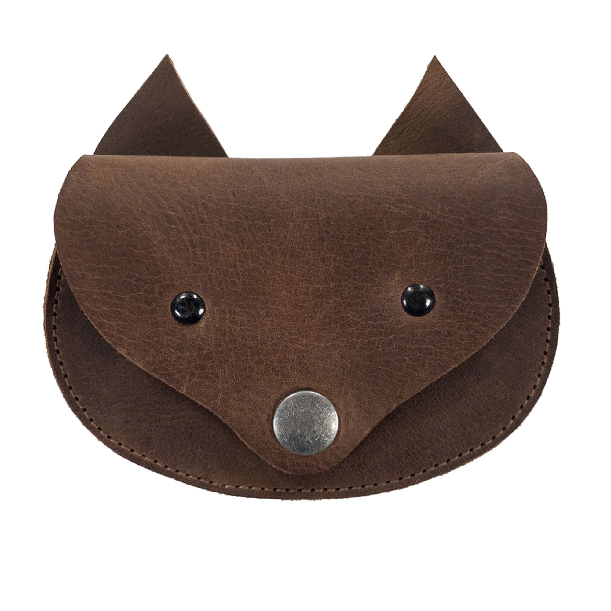 The Foxy Head Shape Coin Pouch by Hide & Play is a charming accessory made from Full Grain Leather. This artisan-crafted piece showcases small batch production, hand cut, and hand sewn techniques, fire branded for authenticity, highlighting its handmade roots in La Antigua Guatemala & Oaxaca Mexico. Perfect for organizing your coins or small essentials.