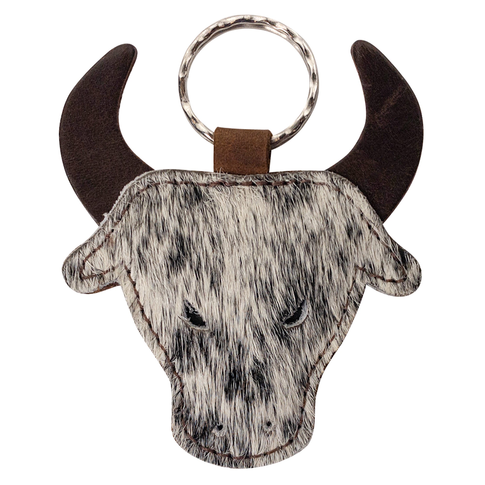 Cowboy Bull Head Keychain by Western Leather Works featuring a handcrafted bull head design made from soft hair-on-hide full grain leather. A stylish keyring holder, perfect as an accessory for cowboys and cowgirls. Each piece is part of small batch production, hand cut, hand sewn, fire branded, and artisan made in La Antigua Guatemala & Oaxaca Mexico.