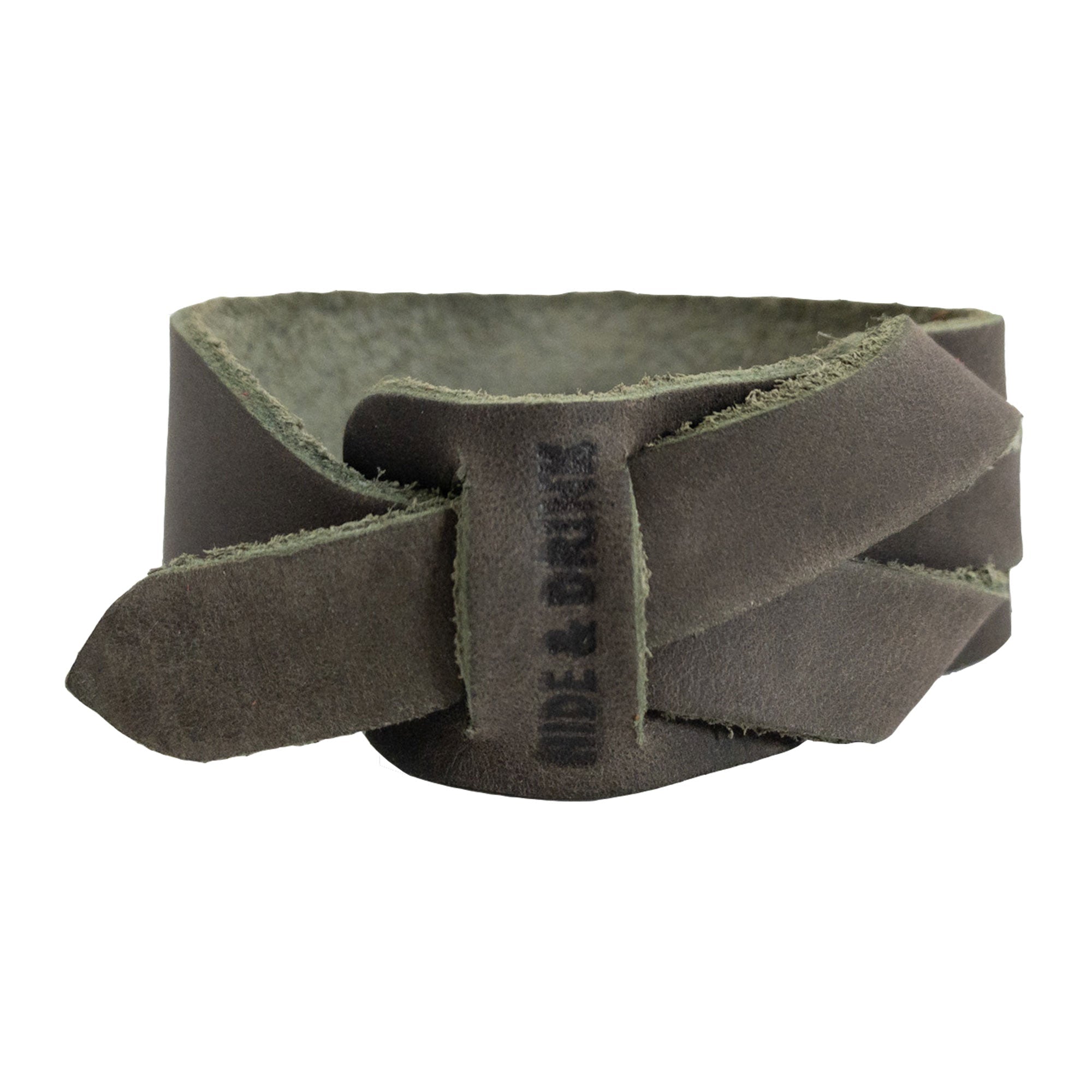 Hide & Drink's Minimalist Wristband in earthy green full grain leather, highlighting its organic feel and stylish design. This adjustable cuff is handcrafted by artisans in La Antigua Guatemala, showcasing StockyardX's commitment to artisan quality and small batch production.