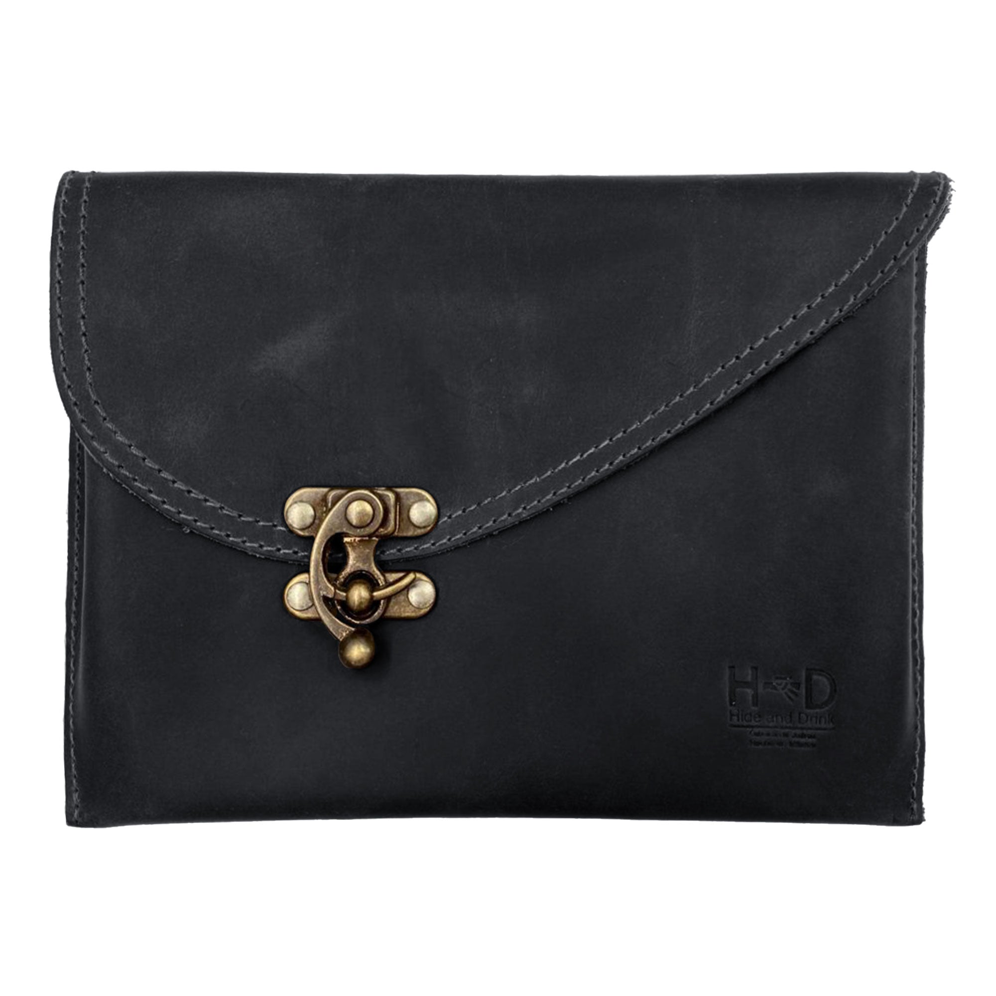 A stylish Petite Vintage Clutch Bag handcrafted by Hide & Drink, showcasing a unique vintage style clasp and made from high-quality Full Grain Leather. This Petit Clutch Bag is perfect as a Vintage Handbag, ideal for evenings out or as a chic Travel Accessory. Each bag features small batch production with hand cut and hand sewn details, fire branded for authenticity, and made by artisans in La Antigua Guatemala & Oaxaca Mexico.