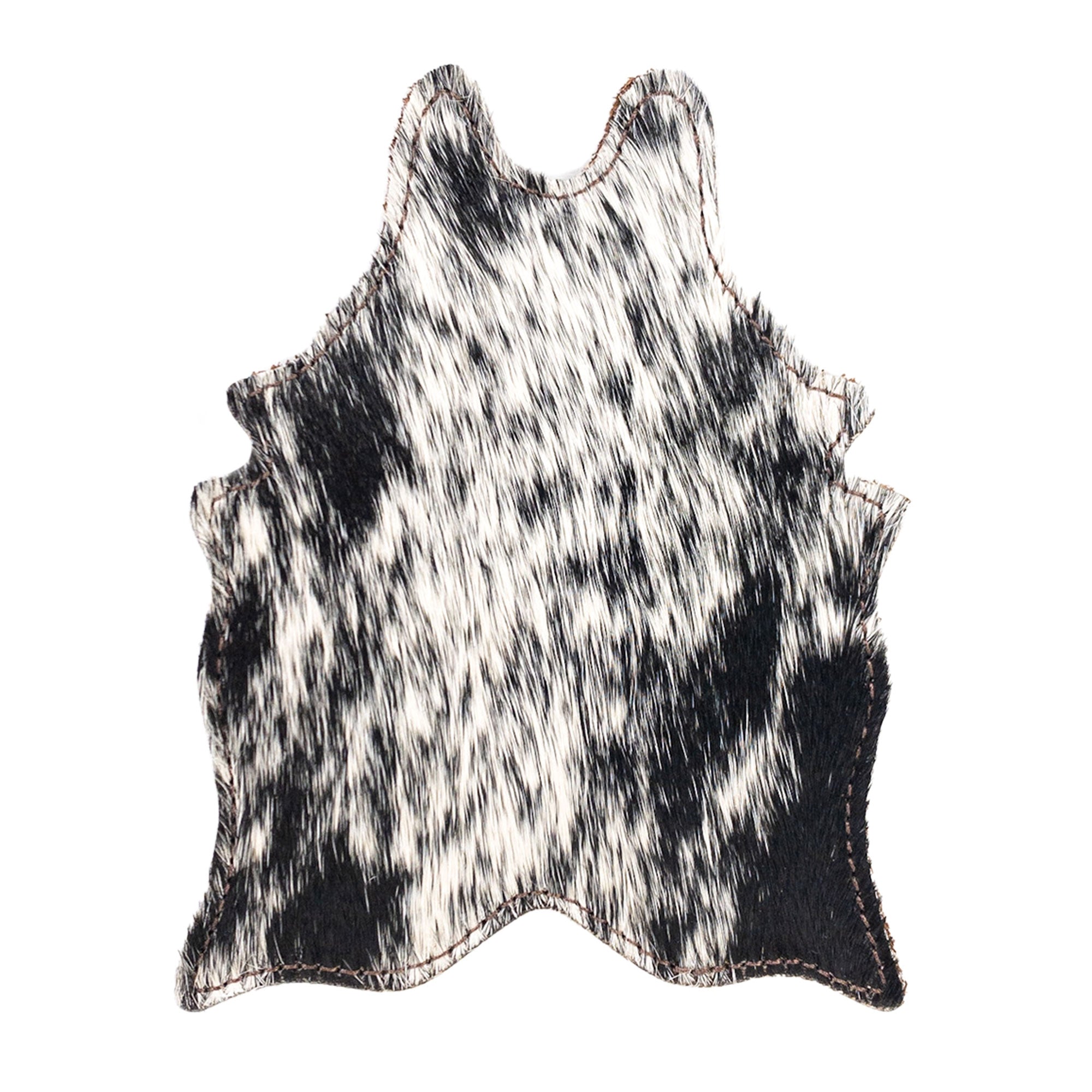 Close-up of a unique black and white Cowhide Shape Set of 6 Coasters from Western Leather Works, made from Hair On Hide Full Grain Leather. Perfect for drinks, these artisan coasters are handcrafted in La Antigua Guatemala & Oaxaca Mexico, showcasing small batch production techniques.