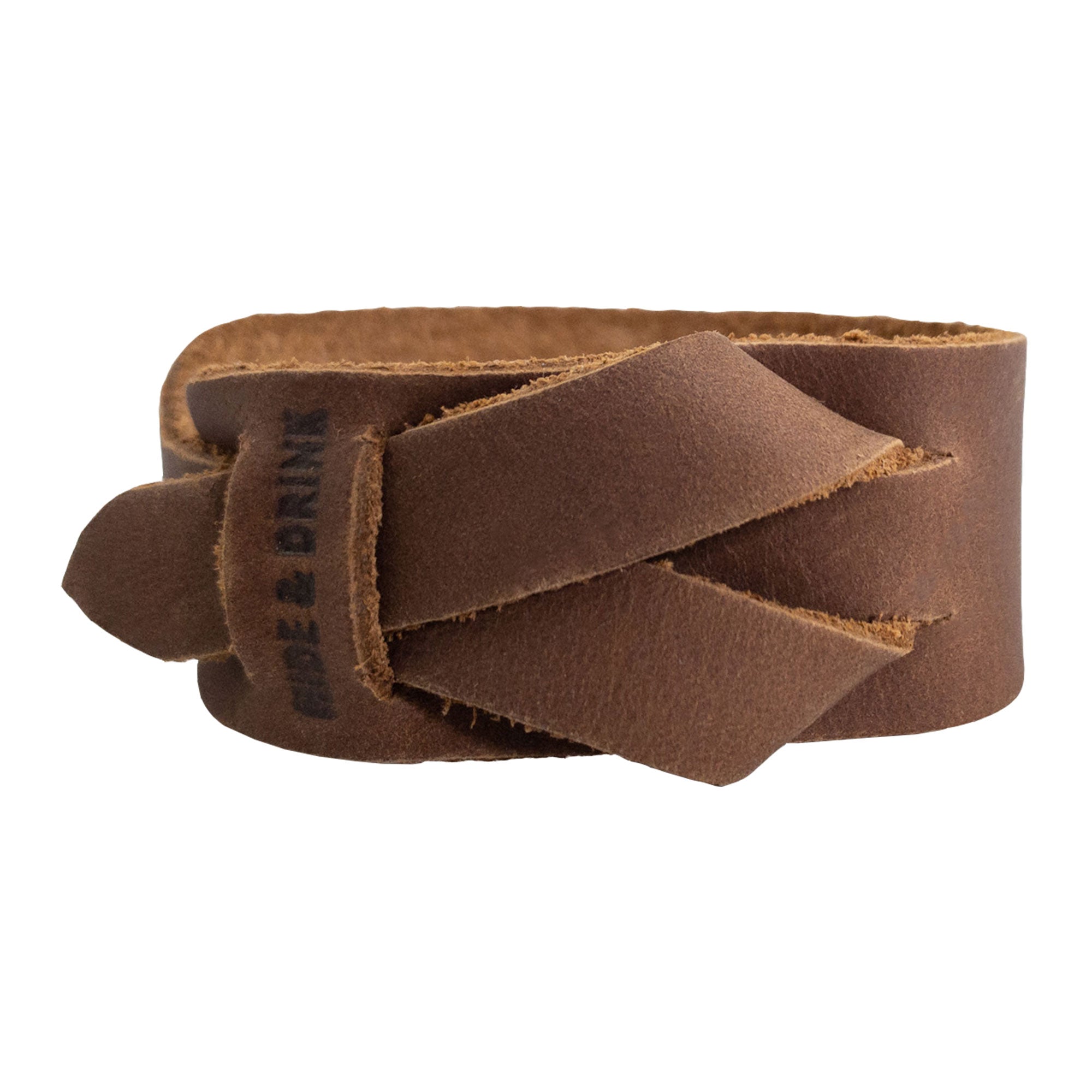 Hide & Drink's Minimalist Wristband in light brown full grain leather, highlighting its traditional design and craftsmanship. This adjustable cuff is a stylish bracelet reflecting StockyardX's artisan quality and commitment to small batch production in La Antigua Guatemala.
