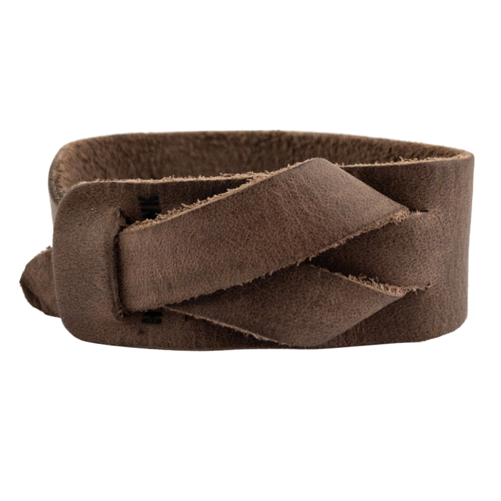 Hide & Drink's Minimalist Wristband made from full grain leather, featuring a rustic design with an adjustable strap. This stylish cuff reflects artisan craftsmanship, being hand cut and hand sewn, perfect for casual wear. Bracelet by StockyardX offering small batch production and fire branded details, handmade in La Antigua Guatemala.