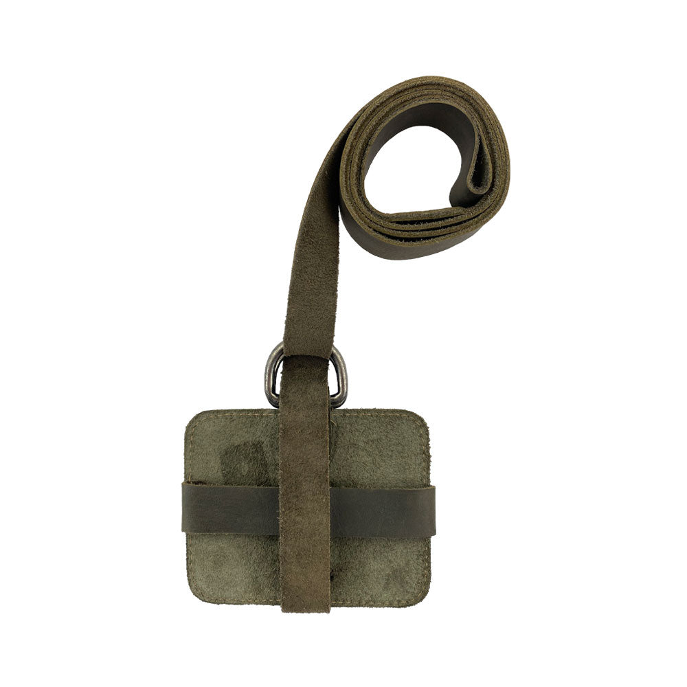 A close-up of the Hide & Drink Book Strap Carrier, highlighting the intricate details of its design and craftsmanship. Made from Full Grain Leather, this artisan product from La Antigua Guatemala is ideal for stylish readers.